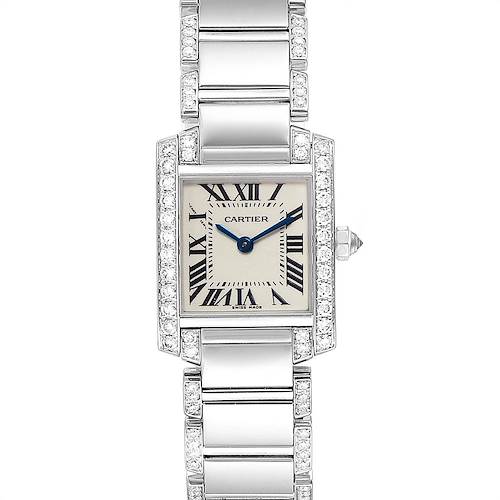 The image shows a Tank Française model watch by Cartier from a top-down angle, highlighting the rectangular face, Roman numerals, and metal strap with diamond accents.