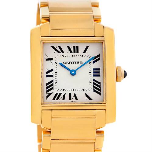 The Cartier Tank Francaise W50003N2 Women's Yellow Gold Silver Dial W50003N2 Women's Yellow Gold Silver Dial watch is shown from a front angle, displaying the entire face, blue hands, roman numerals, and part of the gold bracelet.