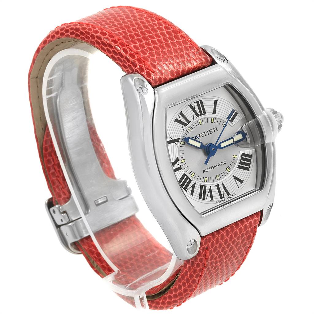 The Cartier W62000V3 Stainless Steel Silver Dial W62000V3 Stainless Steel Silver Dial Roadster Men's Steel Red Strap Large Watch W62000V3 is shown at a three-quarter angle, highlighting its red strap and silver casing.
