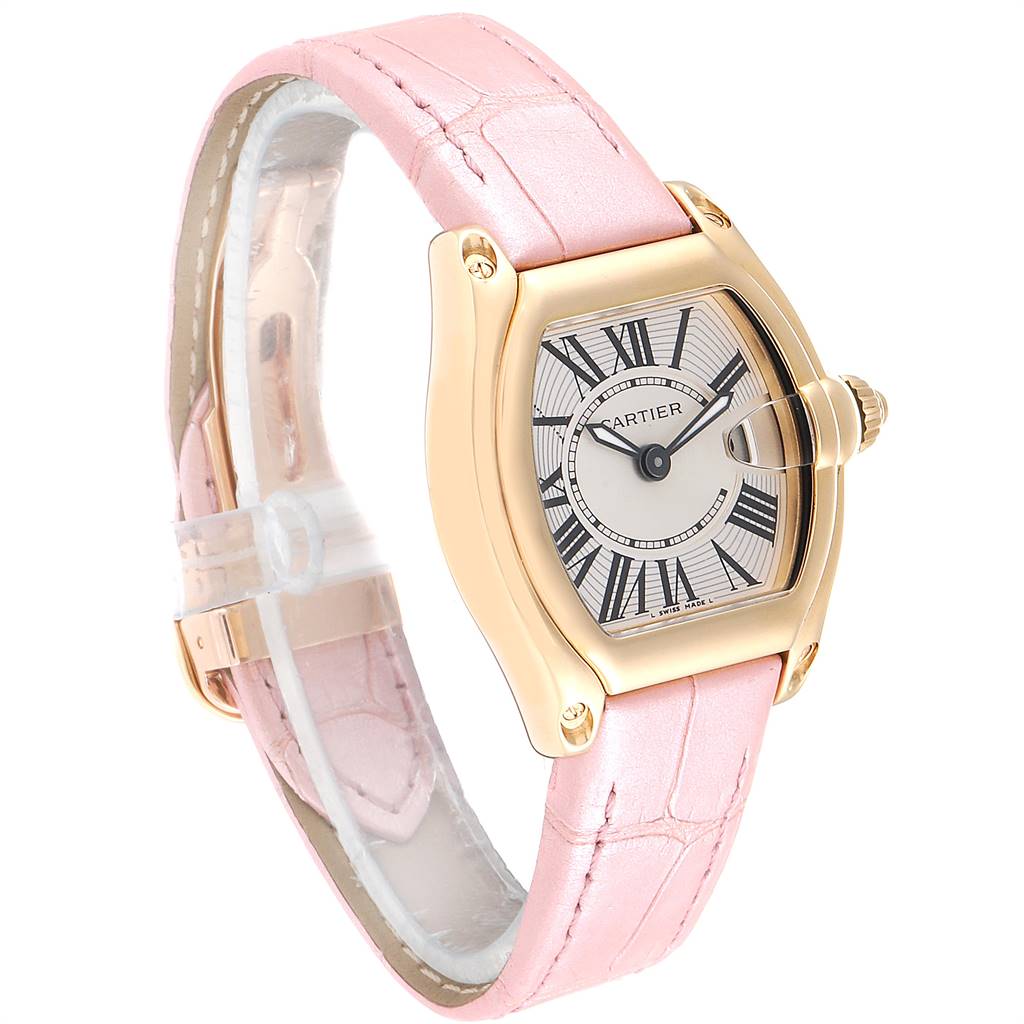 This image shows the Cartier Roadster W62018Y5 Women's Yellow Gold Silver Dial W62018Y5 Women's Yellow Gold Silver Dial watch angled to display its face, bezel, and pink leather strap.