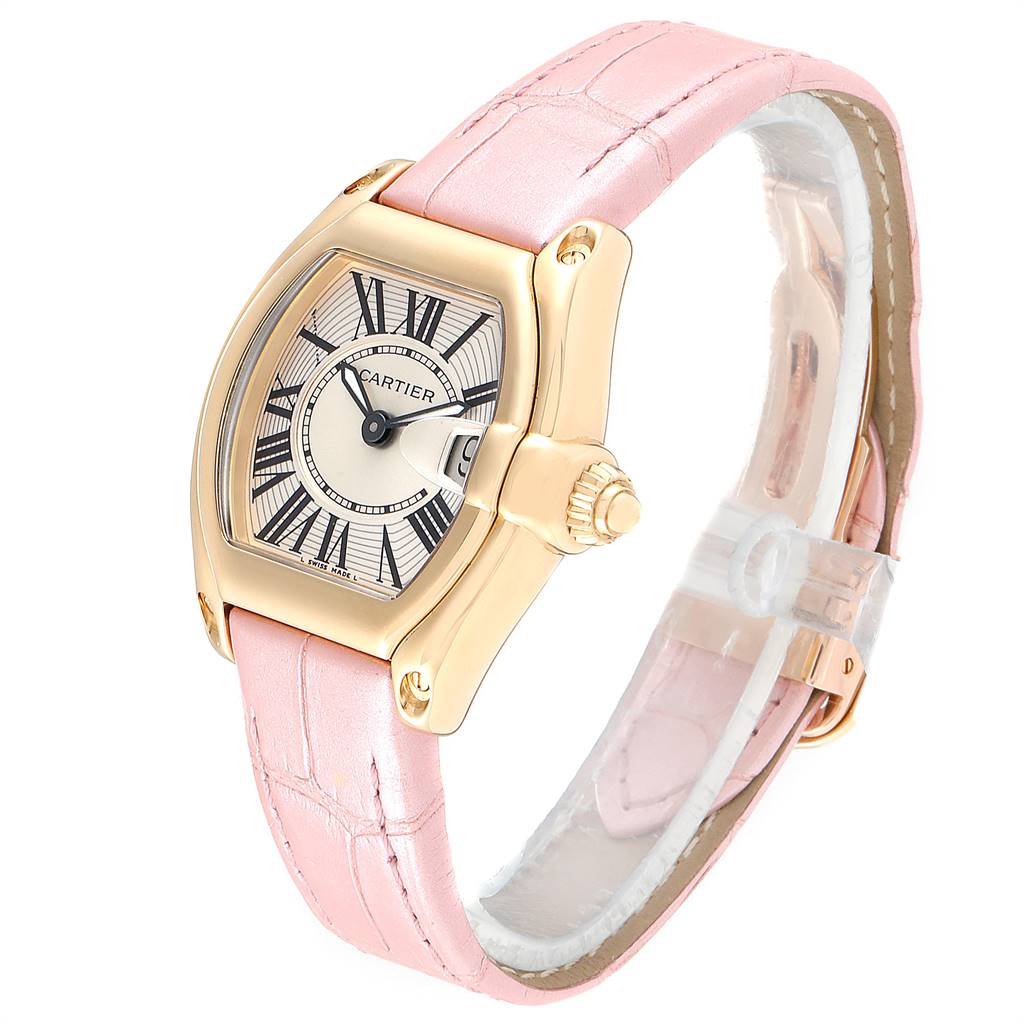 This is a Cartier Roadster W62018Y5 Women's Yellow Gold Silver Dial W62018Y5 Women's Yellow Gold Silver Dial watch shown from an angled side view, featuring a pink leather strap and a gold-tone case.