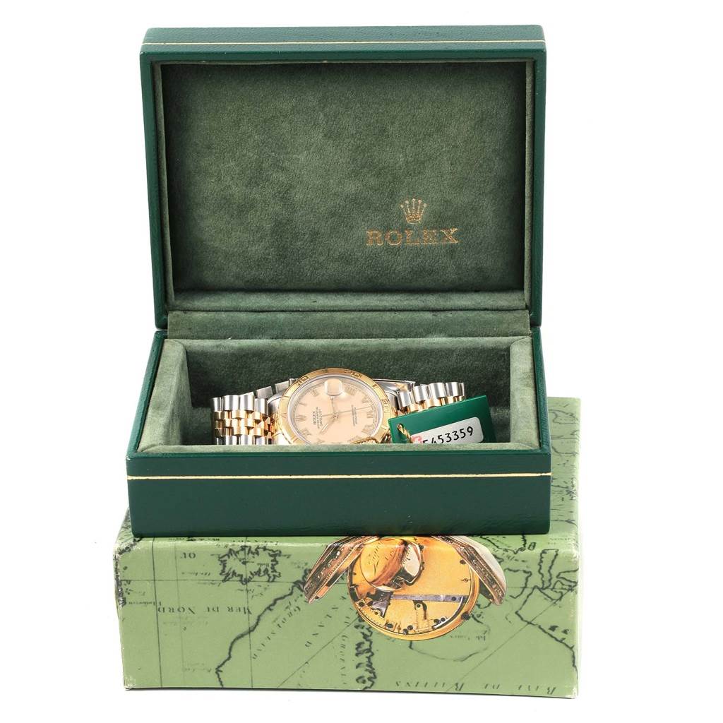 The Rolex Turn-o-Graph 16263 Men's Steel and Gold (two tone) Beige Dial 16263 Men's Steel and Gold (two tone) Beige Dial watch is displayed in a partially open green box, showcasing its dial and bracelet.