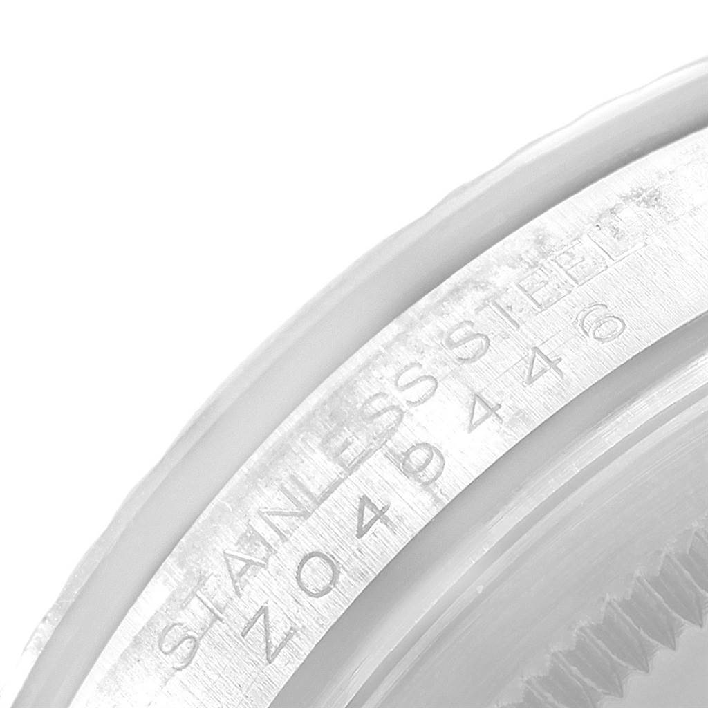 This close-up image shows the serial number engraving on the stainless steel case of a Rolex Turn-o-Graph 116264 Men's Stainless Steel Black Dial 116264 Men's Stainless Steel Black Dial watch.