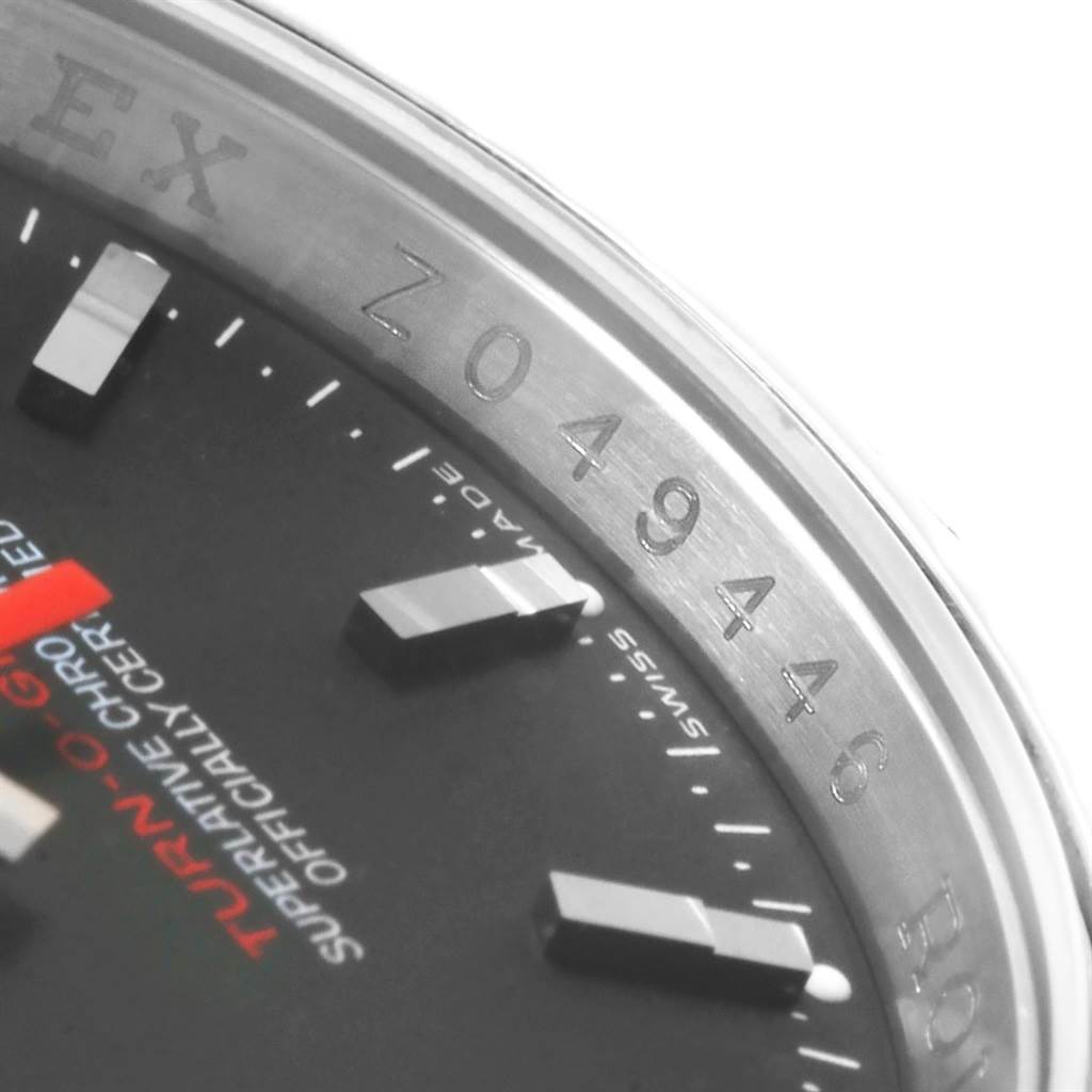 This image shows a close-up of the dial and the serial number on the bezel of the Rolex Turn-o-Graph 116264 Men's Stainless Steel Black Dial 116264 Men's Stainless Steel Black Dial watch.