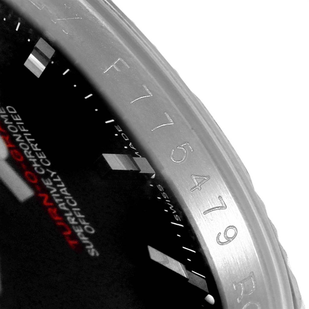 The image shows a partial view of the bezel and part of the dial of a Rolex Turn-o-Graph 116264 Men's Stainless Steel Black Dial 116264 Men's Stainless Steel Black Dial watch, highlighting the model name and serial number.