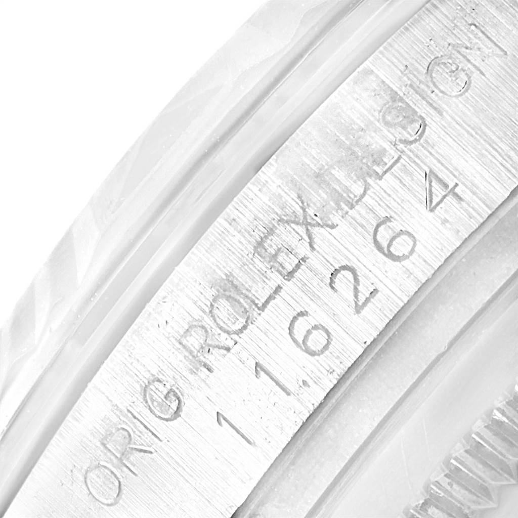 This image shows a close-up of the engraved bezel of a Rolex Turn-o-Graph 116264 Men's Stainless Steel Blue Dial 116264 Men's Stainless Steel Blue Dial model watch.