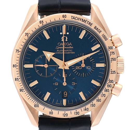 The image shows a front-facing view of an Omega Speedmaster 3653.80.33 Men's Rose Gold Blue Dial 3653.80.33 Men's Rose Gold Blue Dial watch, highlighting the blue dial, gold hands, chronograph subdials, and tachymeter bezel.