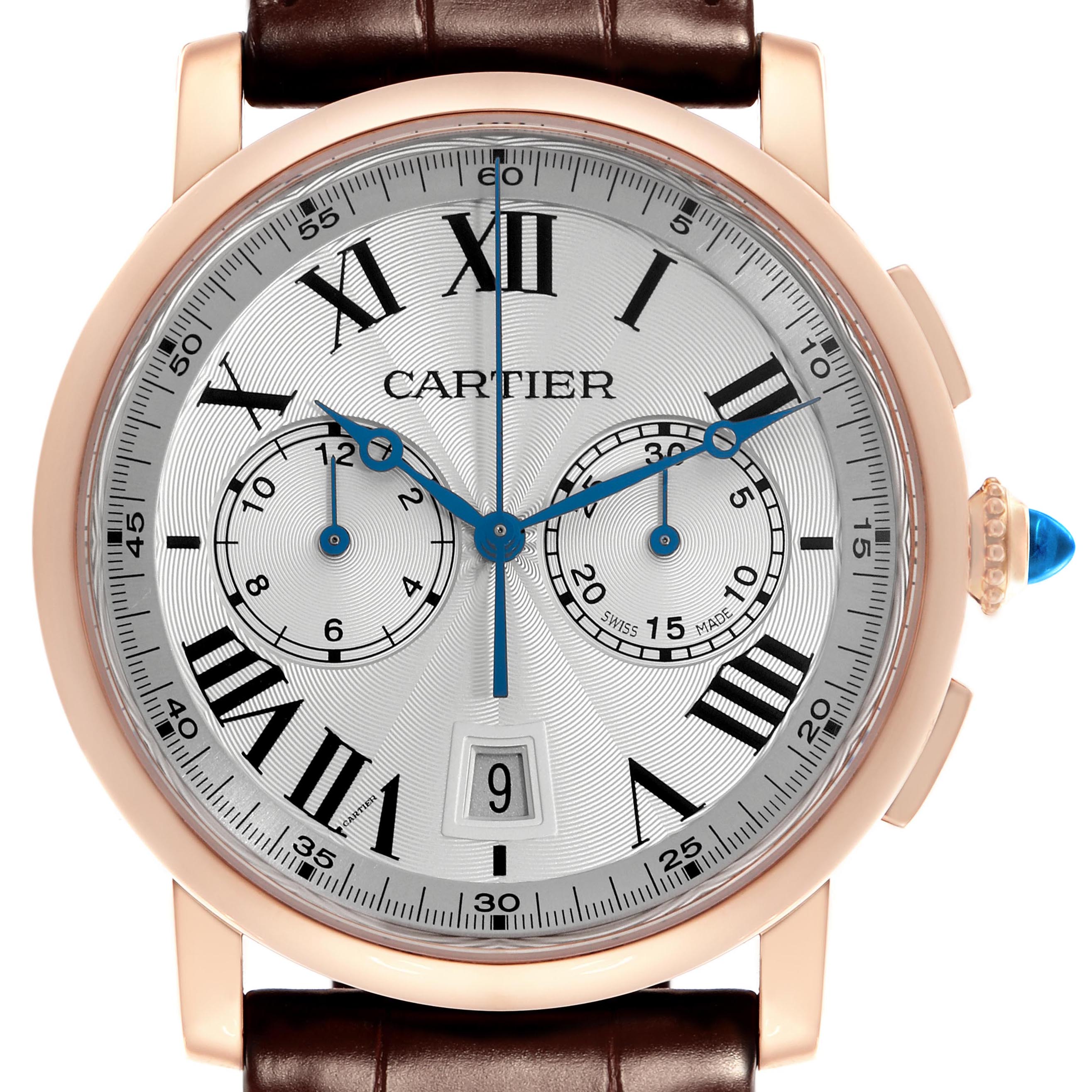 The Cartier Rotonde W1556238 Men's Rose Gold Silver Dial W1556238 Men's Rose Gold Silver Dial watch is shown from the front, highlighting its dial, Roman numerals, subdials, and crown with a blue gem.