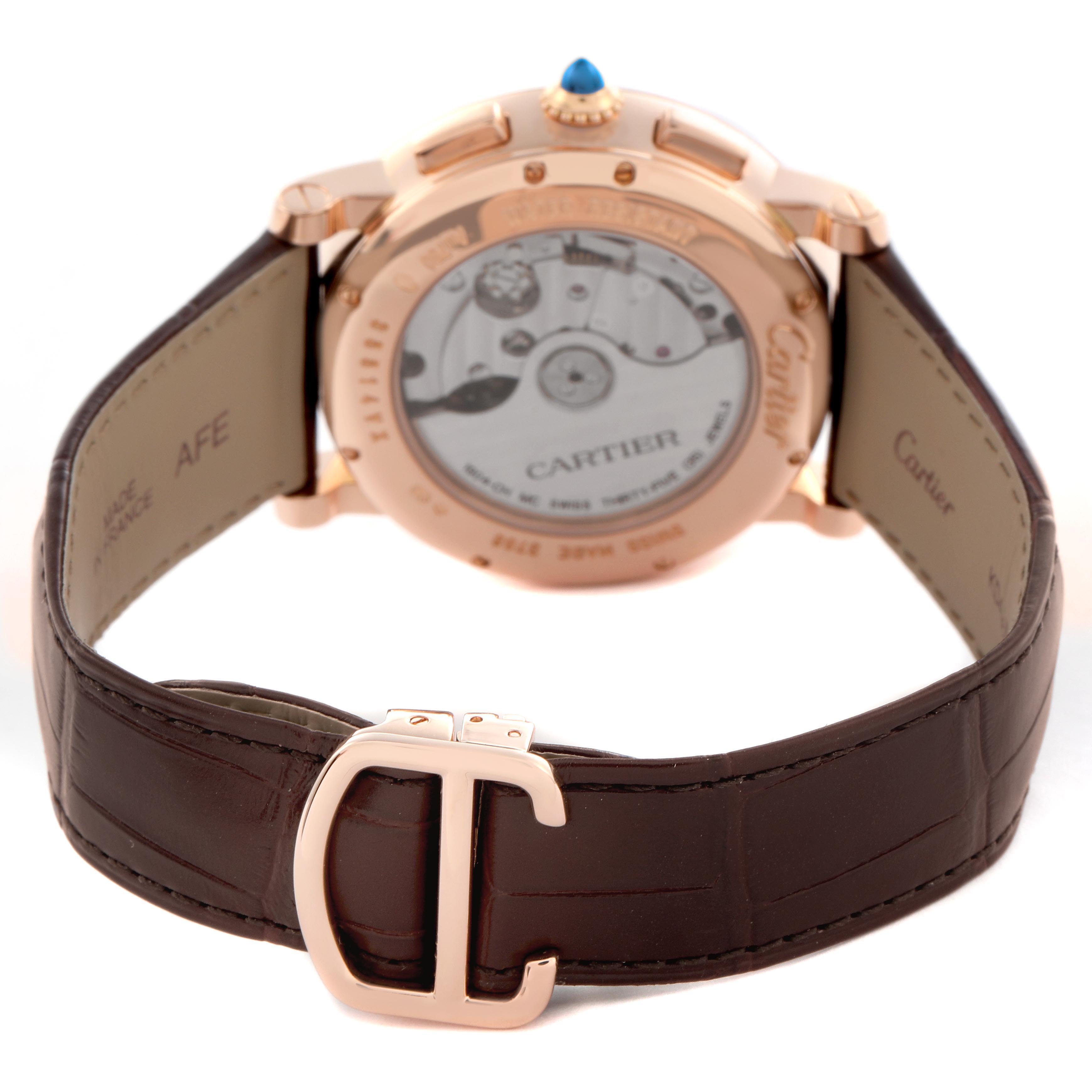 The Rotonde de Cartier watch is shown from the back, revealing its movement, strap, and clasp.