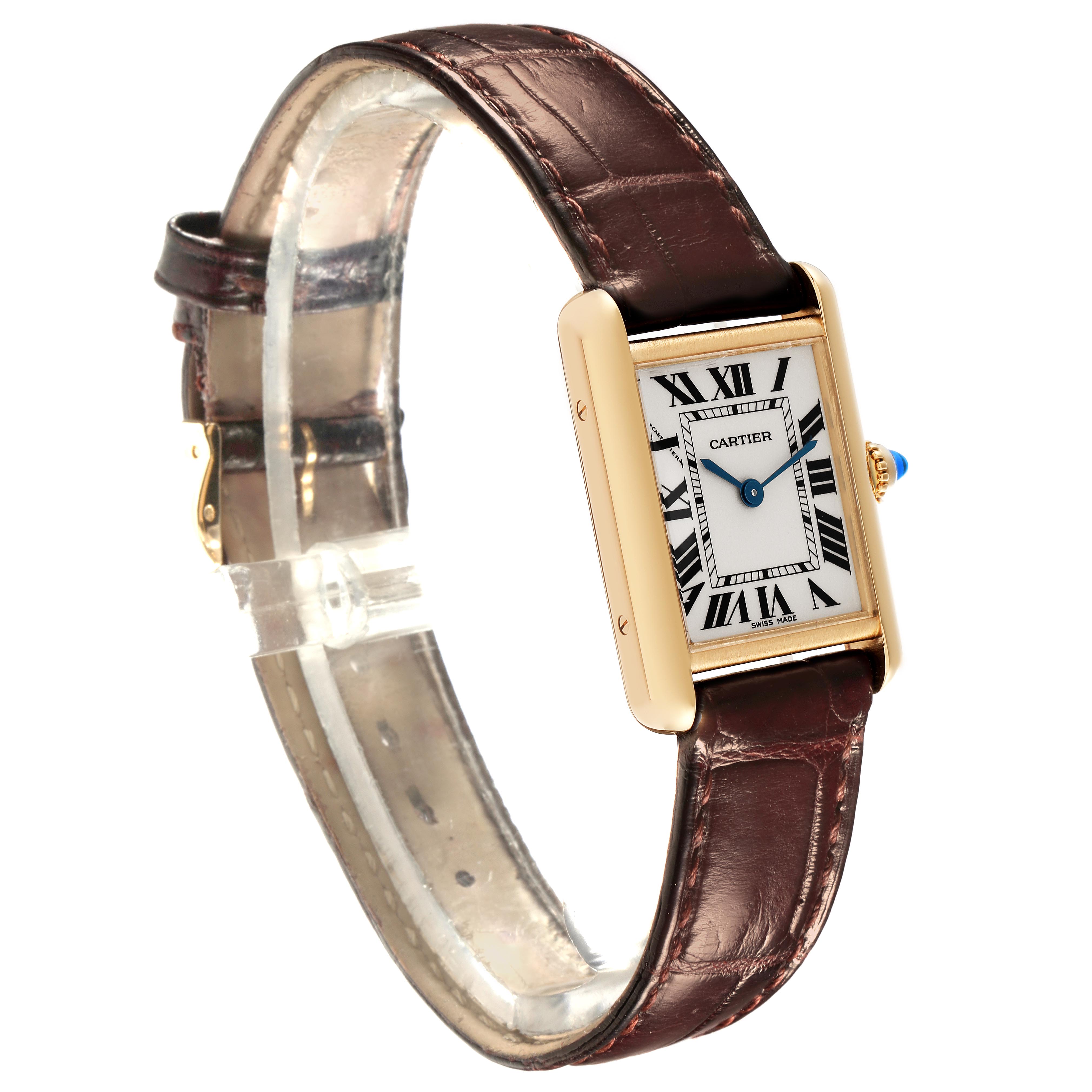 The Cartier Tank Louis W1529856 Women's Yellow Gold Silver Dial W1529856 Women's Yellow Gold Silver Dial watch is shown at a slight angle, highlighting the face, gold case, and brown leather strap.