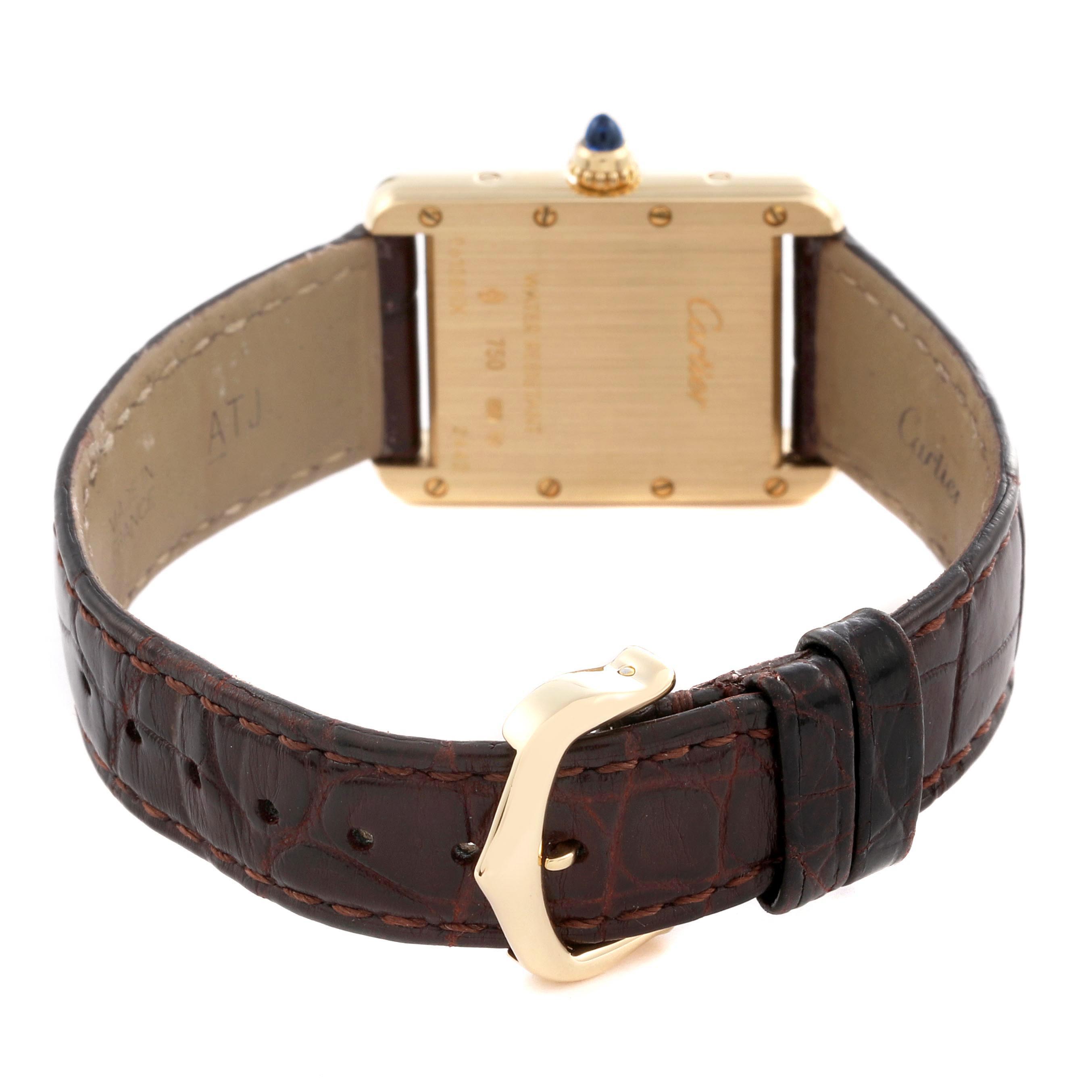 The image shows the back view of a Cartier Tank Louis W1529856 Women's Yellow Gold Silver Dial W1529856 Women's Yellow Gold Silver Dial watch, highlighting the case back, leather strap, buckle, and crown.