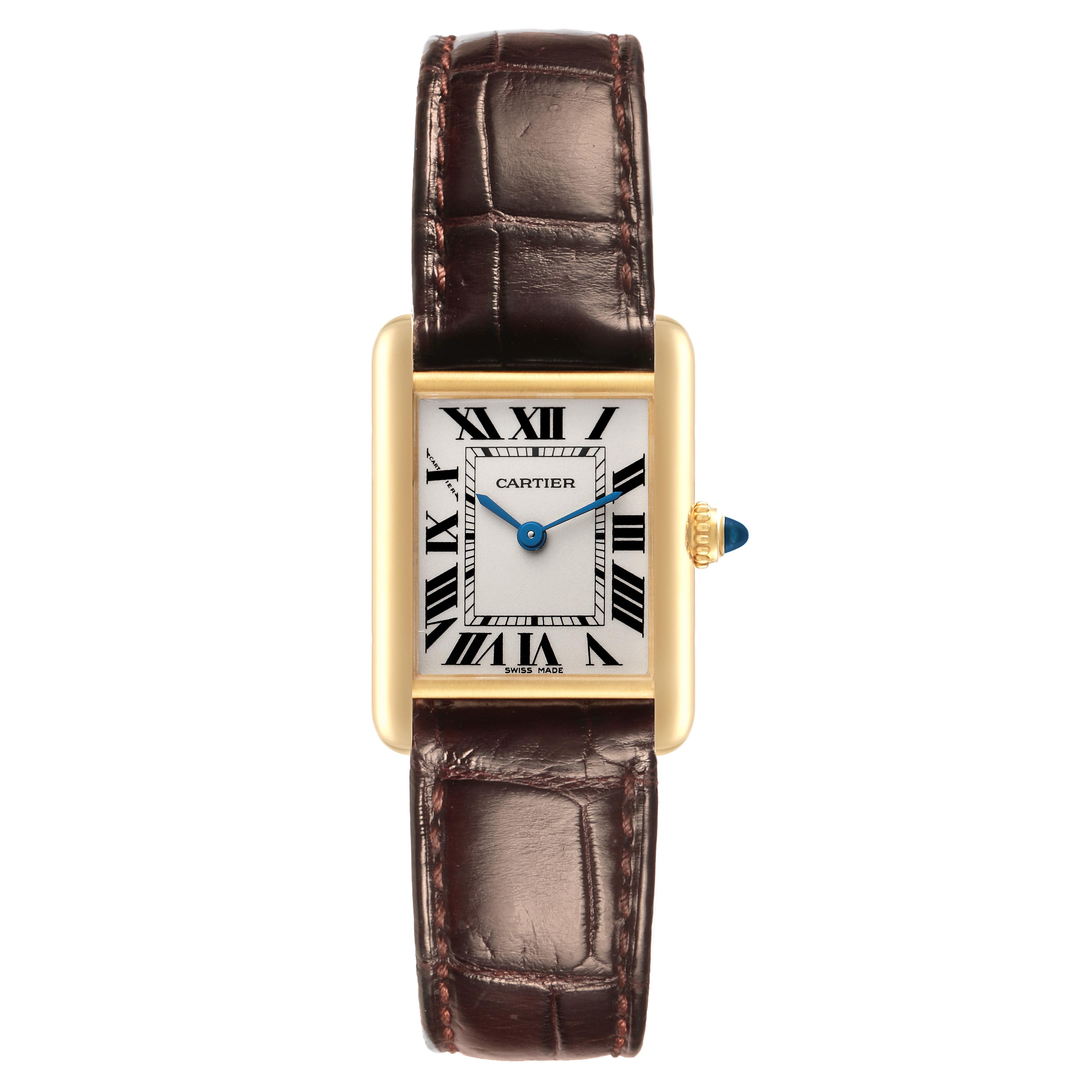 The Cartier Tank Louis W1529856 Women's Yellow Gold Silver Dial W1529856 Women's Yellow Gold Silver Dial watch is shown from the front, featuring its rectangular gold case, brown leather strap, and blue hands.