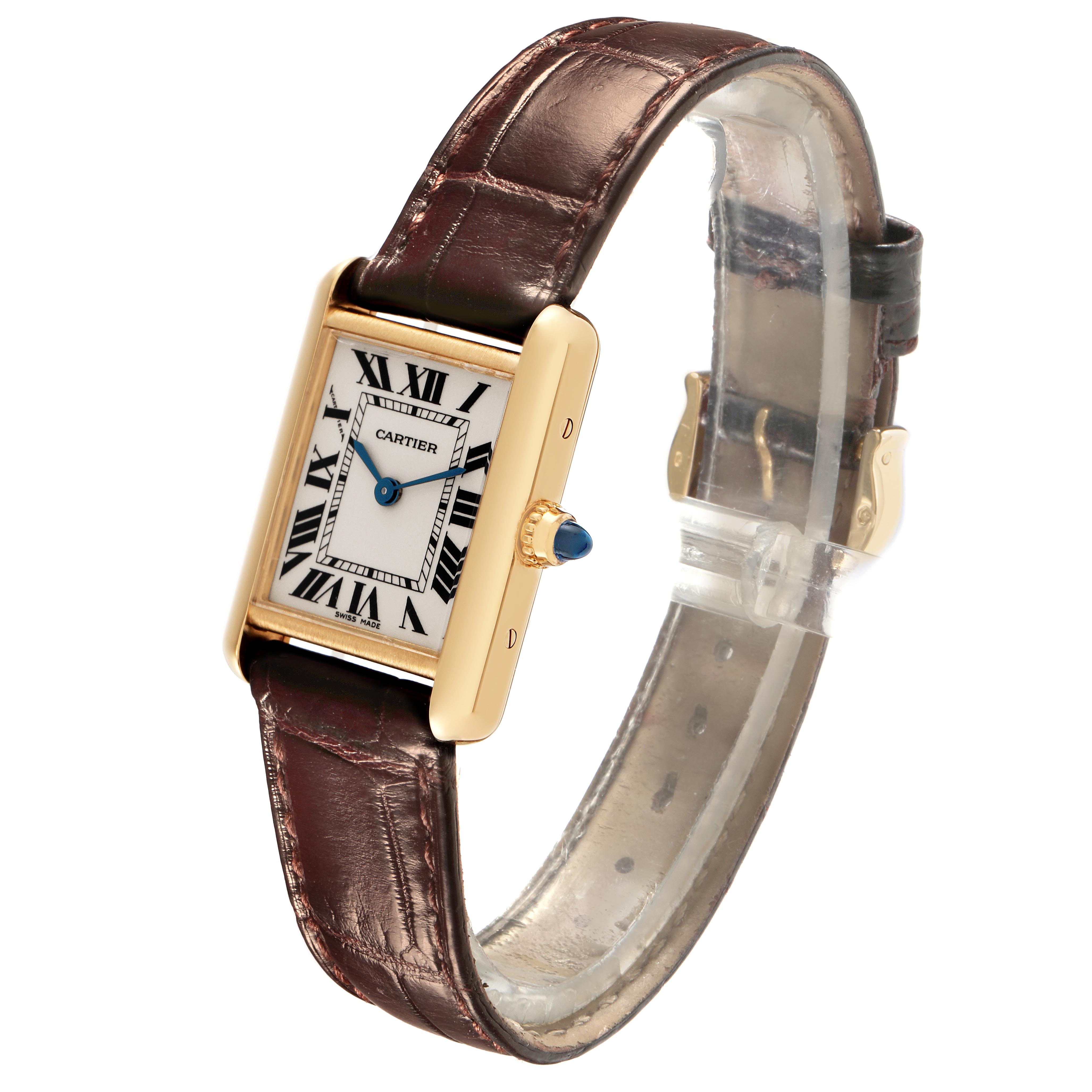 The Cartier Tank Louis W1529856 Women's Yellow Gold Silver Dial W1529856 Women's Yellow Gold Silver Dial watch is shown at a slight angle, highlighting the face, crown, and brown leather strap.
