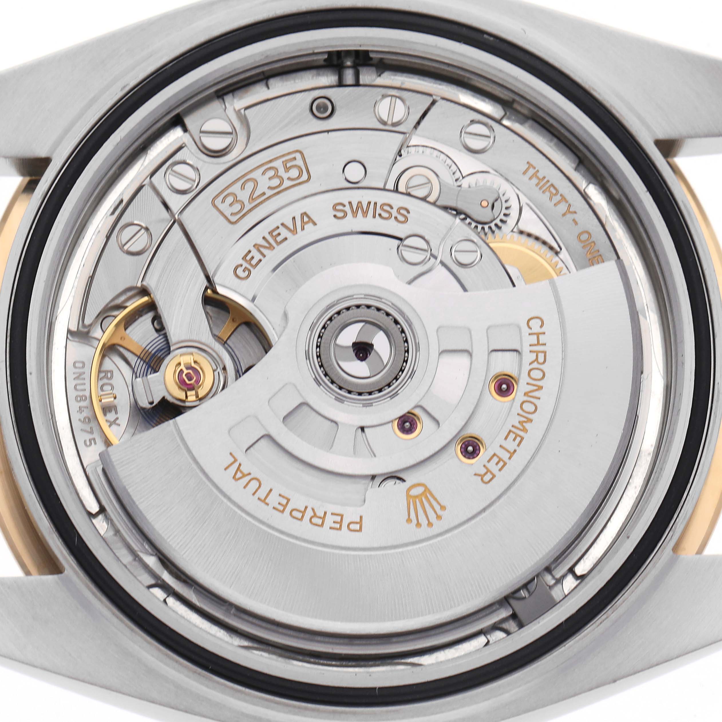 The image shows the movement of a Rolex Datejust 41 126333 Men's Steel and Gold (two tone) Silver Dial 126333 Men's Steel and Gold (two tone) Silver Dial, focusing on the rotor and intricate components from a back angle.