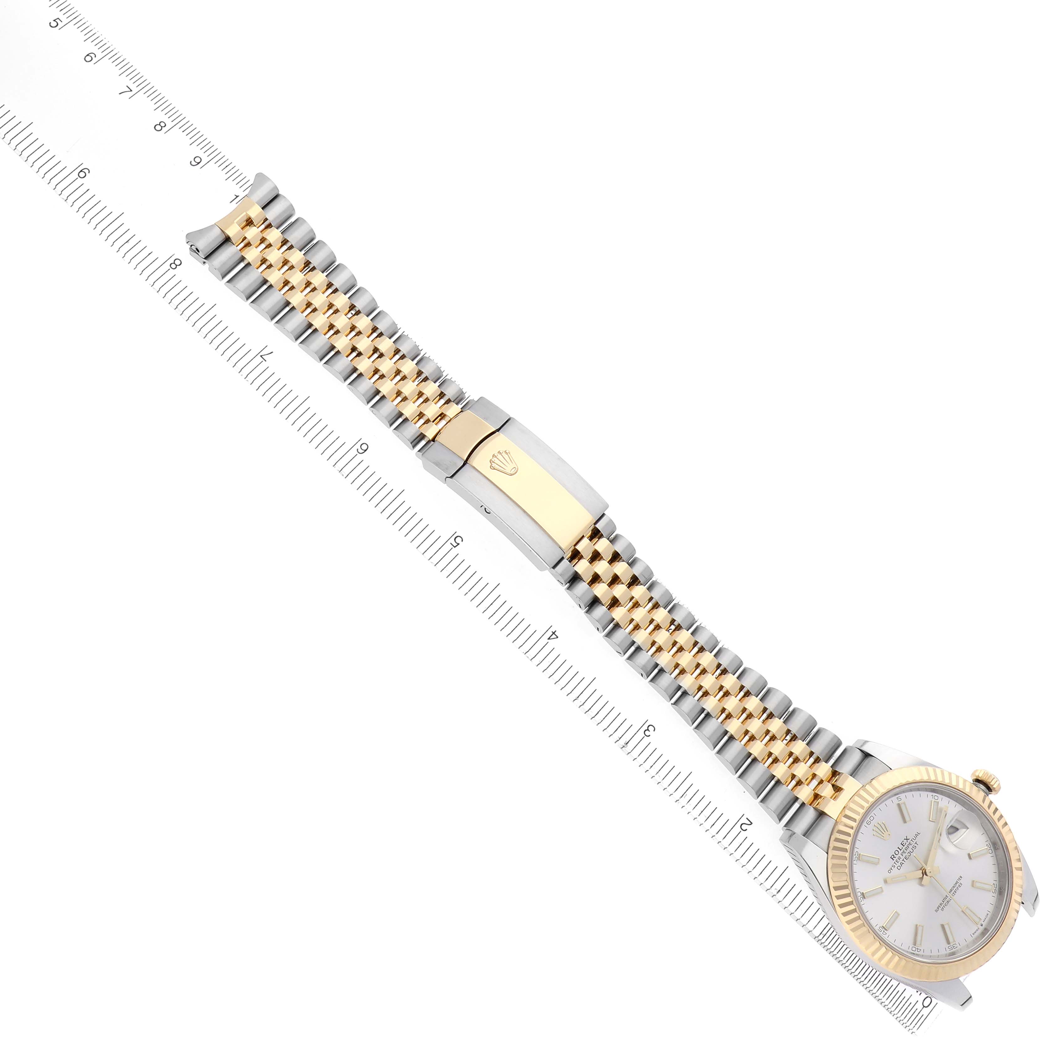 The Rolex Datejust 41 126333 Men's Steel and Gold (two tone) Silver Dial 126333 Men's Steel and Gold (two tone) Silver Dial is shown from a top view, highlighting the two-tone bracelet and clasp, aligned with a ruler.