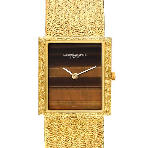 This image shows a front view of a vintage Vacheron Constantin watch, highlighting its square dial and textured gold bracelet.