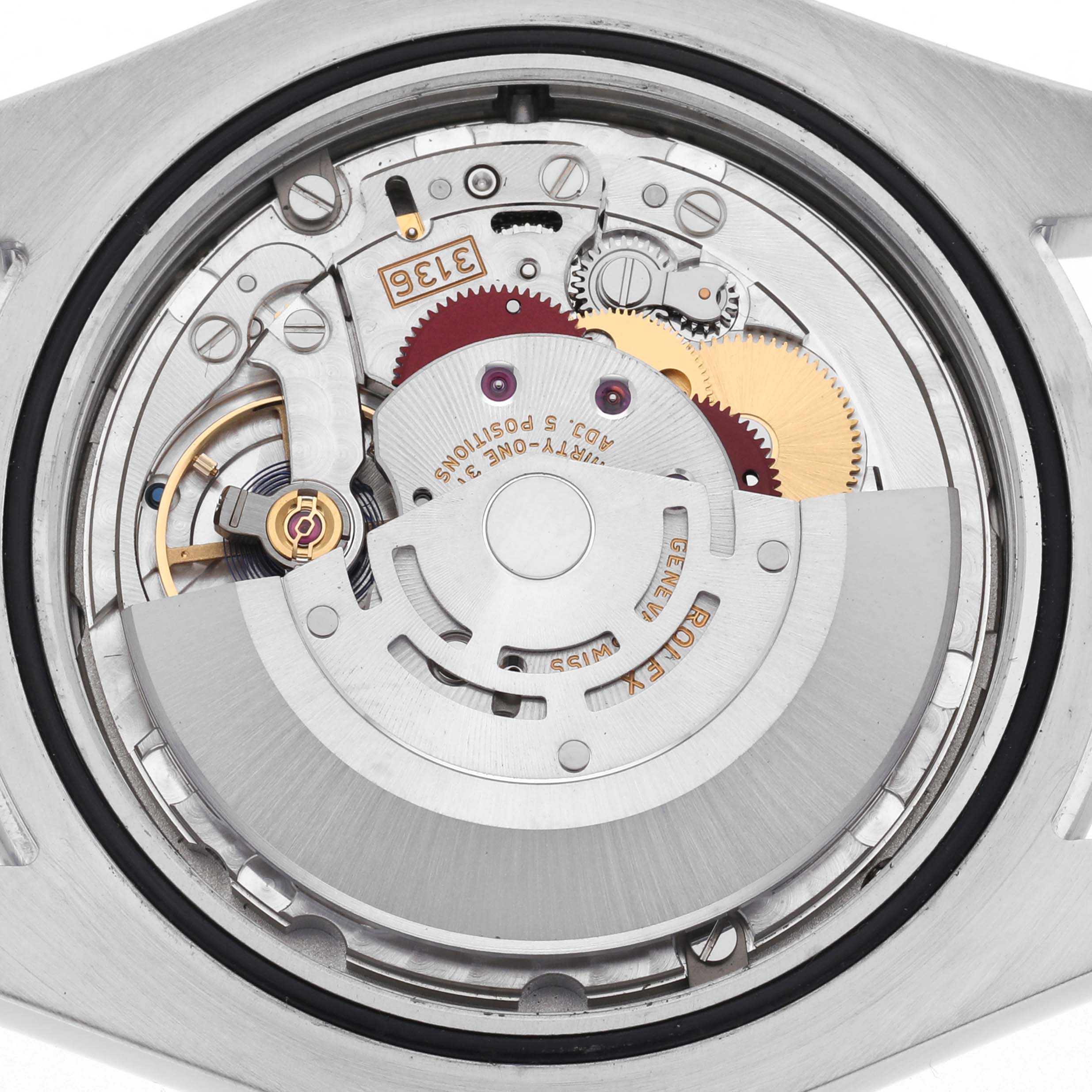 The image shows the internal mechanism of a Rolex Datejust 41 116300 Men's Stainless Steel Silver Dial 116300 Men's Stainless Steel Silver Dial, highlighting gears and the rotor from a back view.