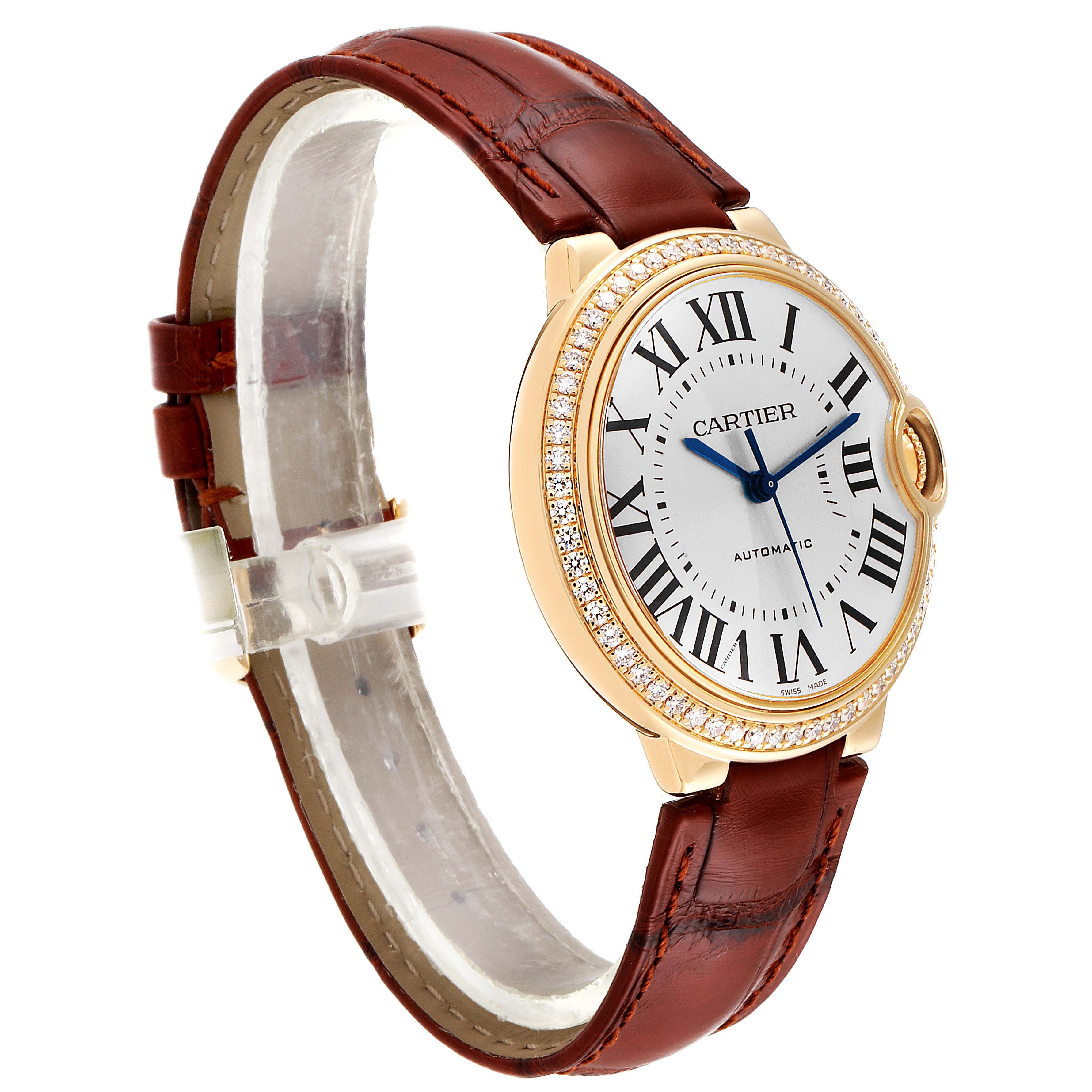 This is a side angle view of the Cartier Ballon Bleu WE900451 Women's Yellow Gold Silver Dial WE900451 Women's Yellow Gold Silver Dial watch, showing its brown leather strap and diamond-encrusted bezel.