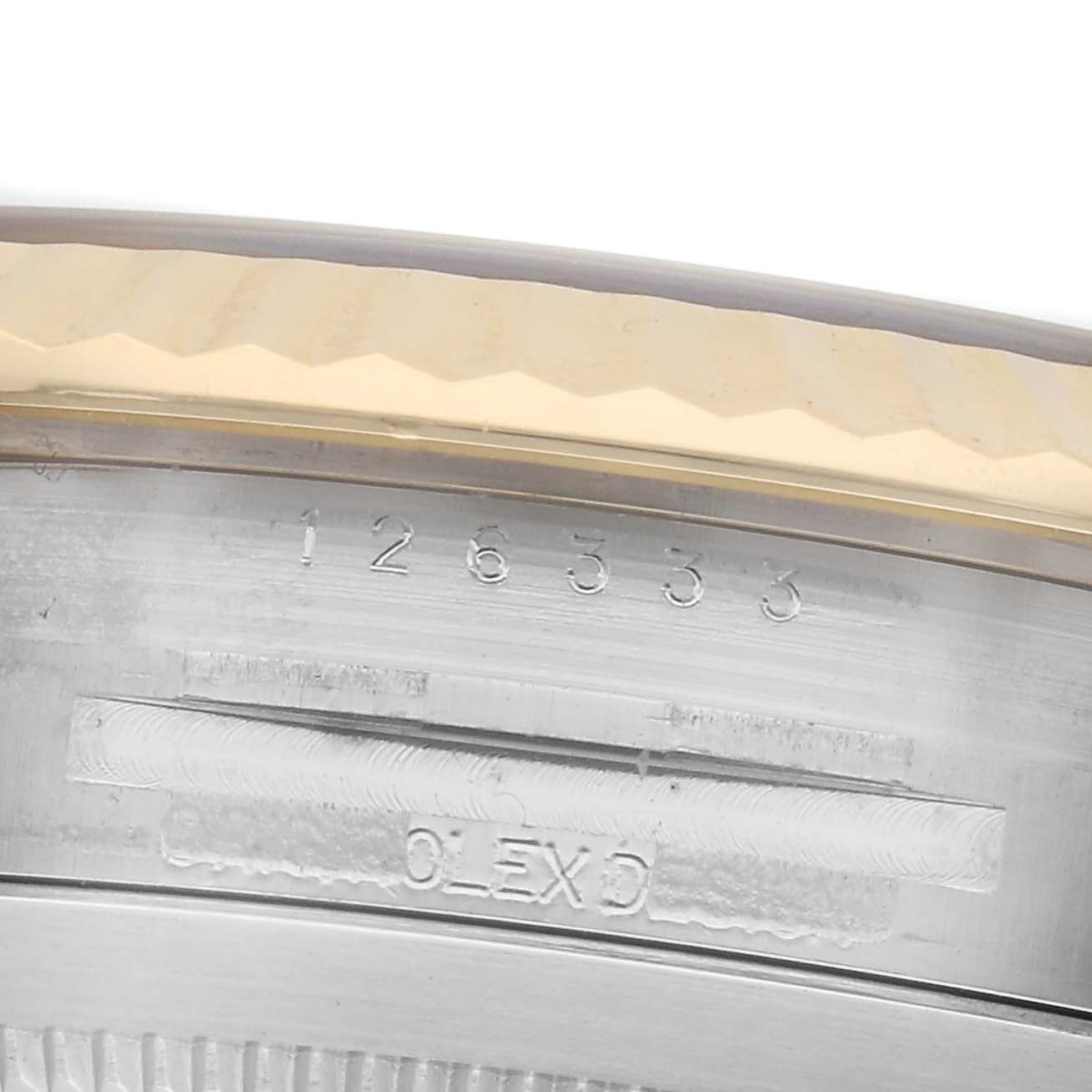 The image shows a close-up view of the Rolex Datejust 41 126333 Men's Steel and Gold (two tone) Silver Dial 126333 Men's Steel and Gold (two tone) Silver Dial's case edge, highlighting the reference number and part of the fluted bezel.