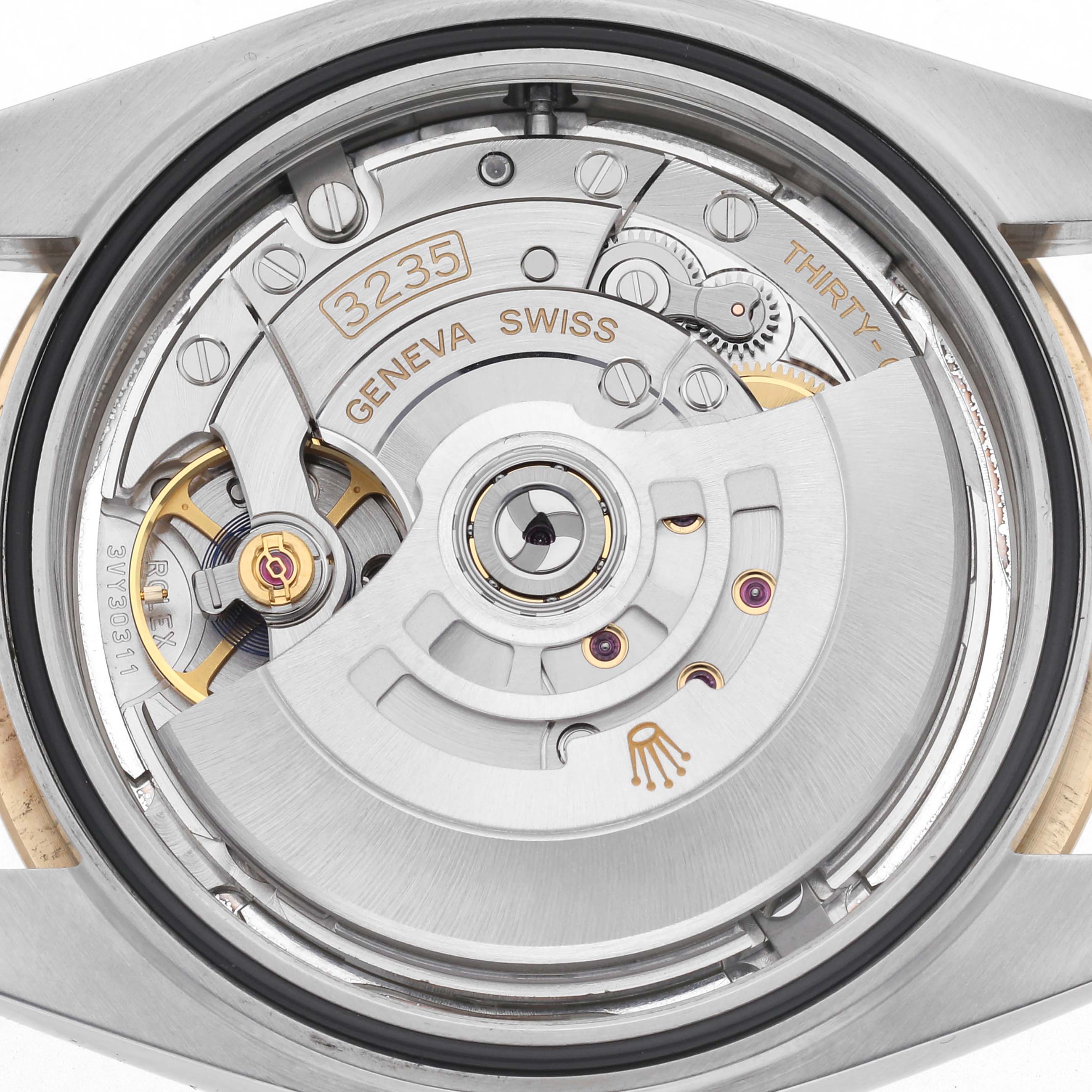 The image shows the movement of the Rolex Datejust 41 126333 Men's Steel and Gold (two tone) Silver Dial 126333 Men's Steel and Gold (two tone) Silver Dial from the back case angle, displaying the intricate mechanics and inscriptions.