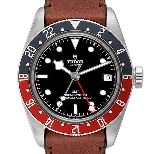 The image shows a front view of the Tudor Heritage Black Bay 79830RB Men's Stainless Steel Black Dial 79830RB Men's Stainless Steel Black Dial watch with a brown leather strap and a red and blue bezel.