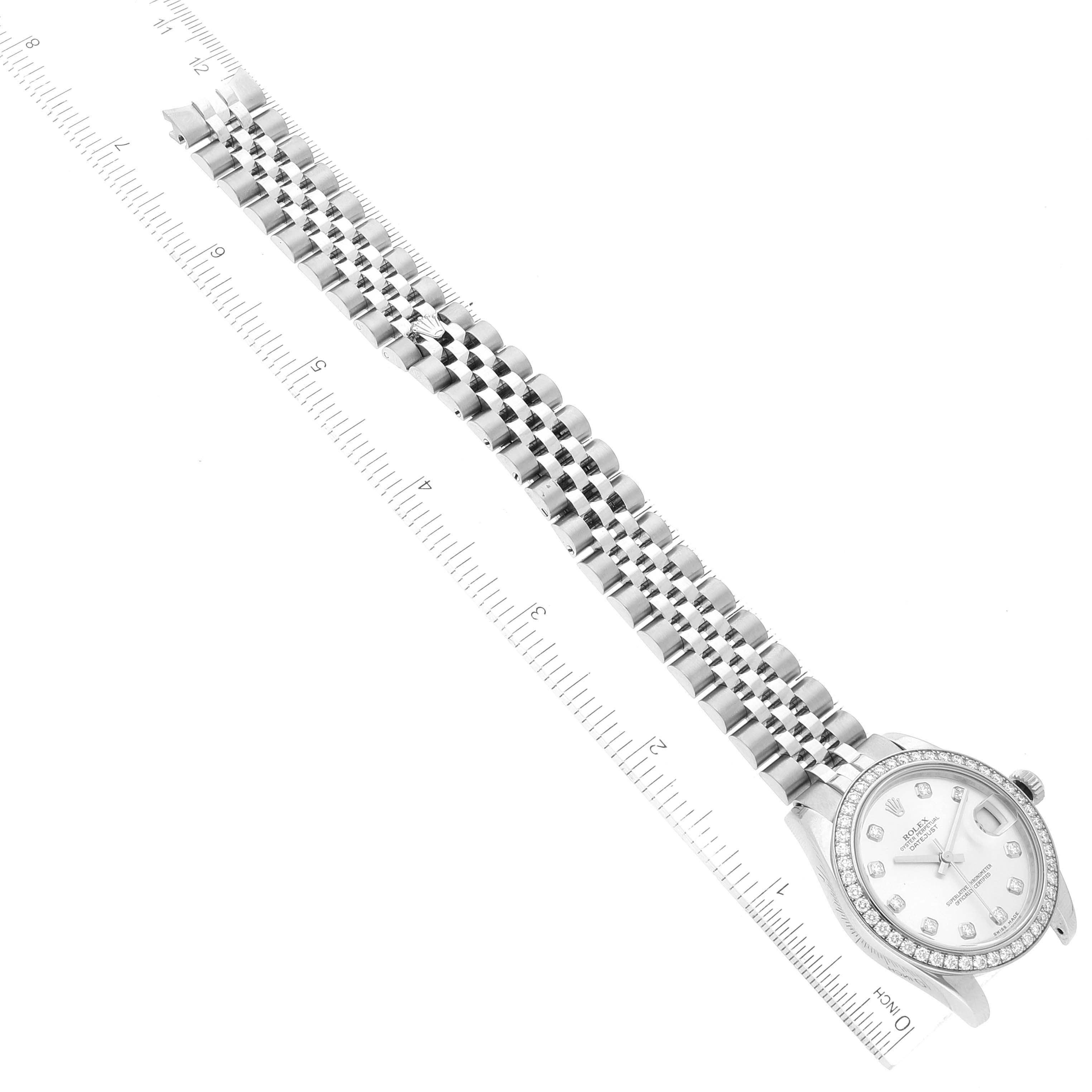 The image shows a right-side view of a Rolex Mid-Size 178384 Women's Stainless Steel Silver Dial 178384 Women's Stainless Steel Silver Dial watch, highlighting the face, bezel, and bracelet, alongside measuring rulers.