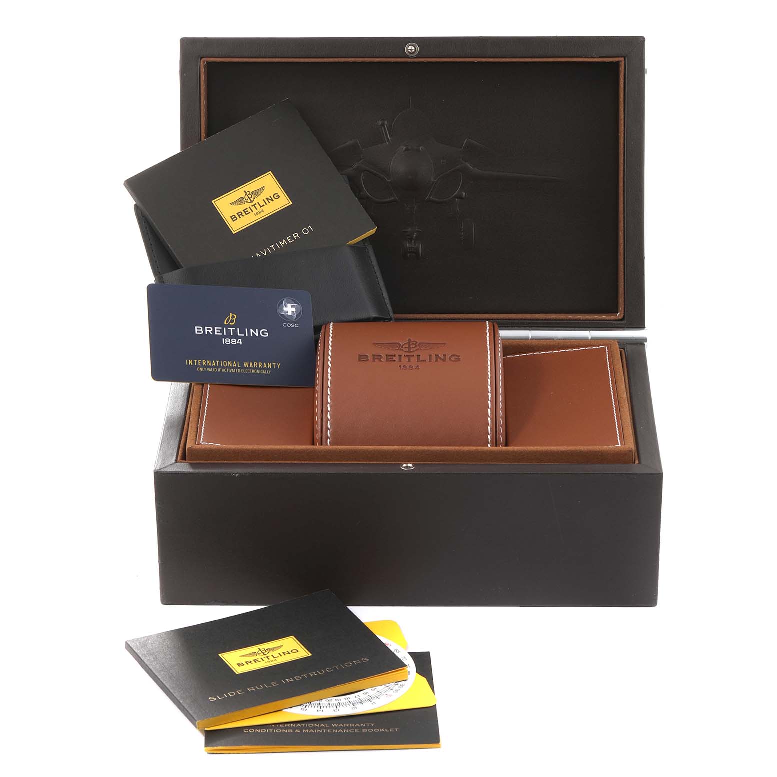 The image shows a top-down view of Breitling Navitimer RB0120 Men's Rose Gold Black Dial RB0120 Men's Rose Gold Black Dial watch accessories, including a warranty card, instruction booklets, and a leather case inside a box.