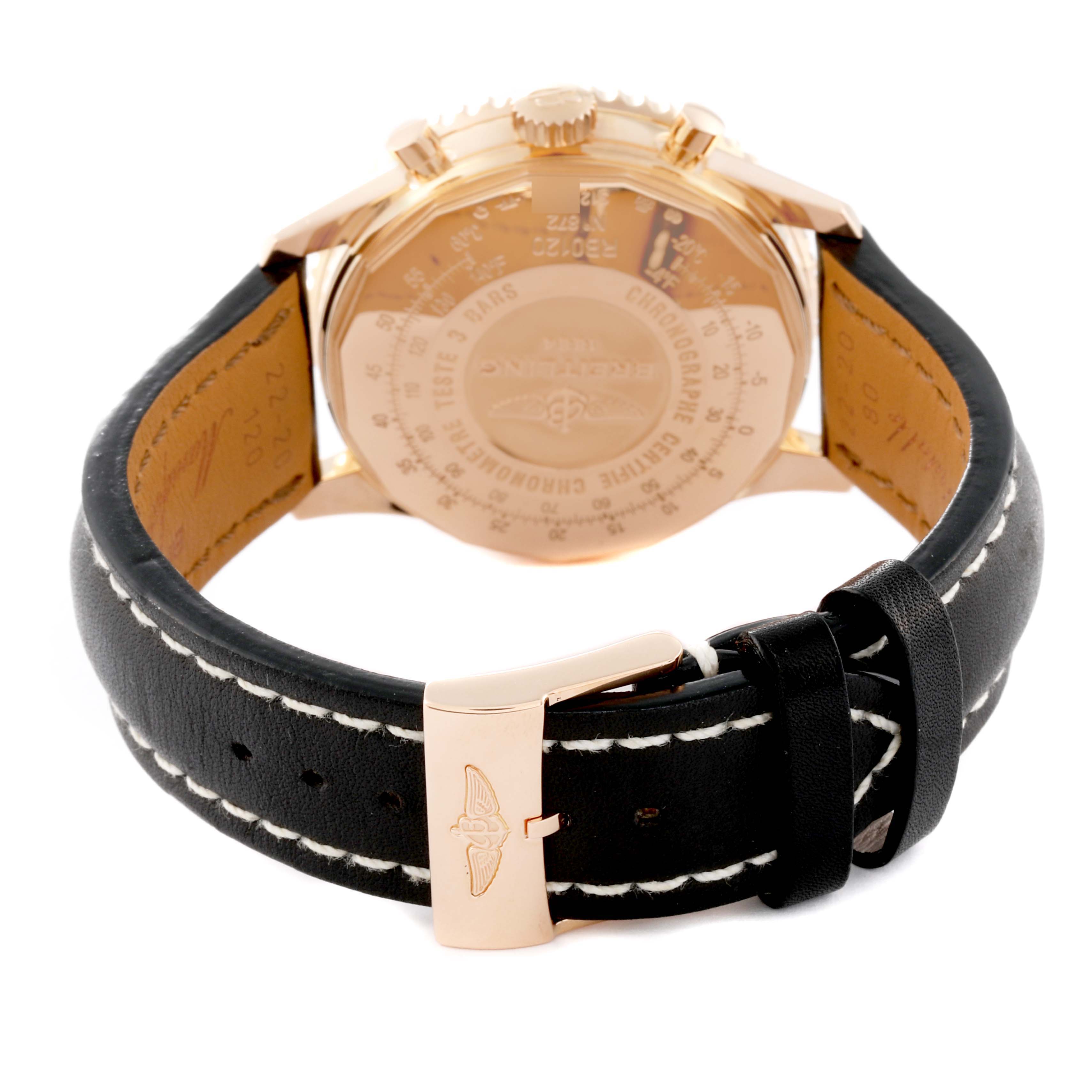 The image shows the rear view of a Breitling Navitimer RB0120 Men's Rose Gold Black Dial RB0120 Men's Rose Gold Black Dial watch, highlighting its back casing and black leather strap with a gold buckle.
