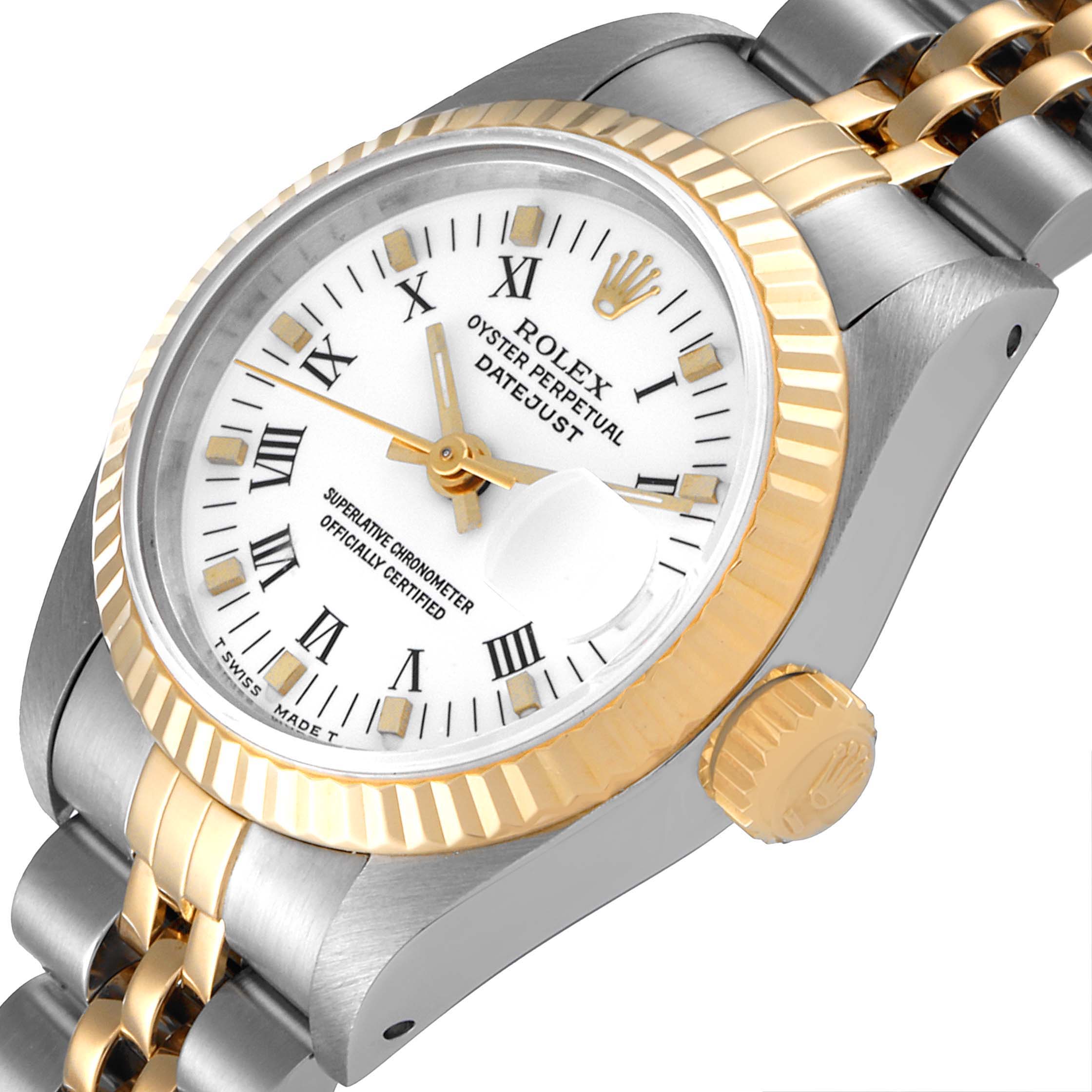 The Rolex Datejust 69173 Women's Steel and Gold (two tone) White Dial 69173 Women's Steel and Gold (two tone) White Dial watch is shown at a tilted angle, highlighting its face, bezel, crown, and part of its bracelet.