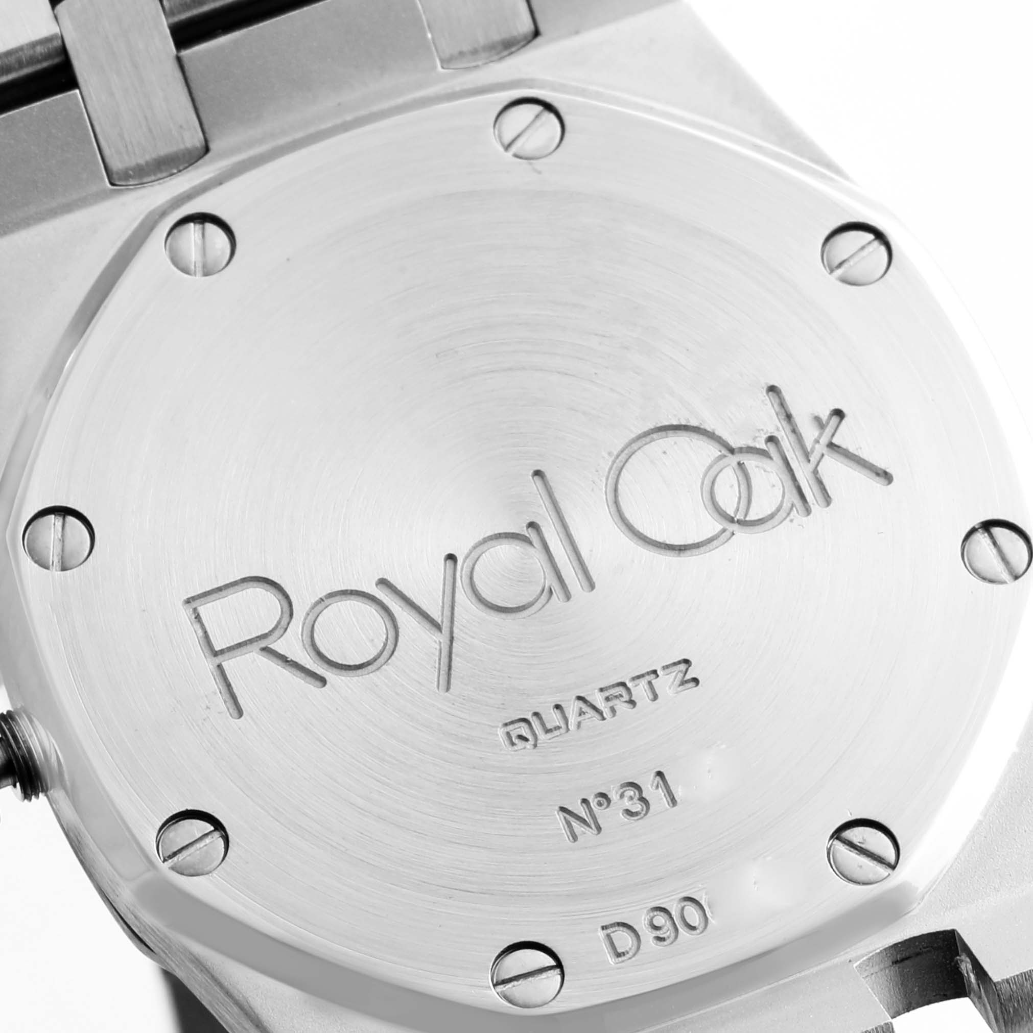 The image shows the case back of an Audemars Piguet Royal Oak 56303ST.OO.0789ST Men's Stainless Steel Black Dial 56303ST.OO.0789ST Men's Stainless Steel Black Dial watch, displaying its engraving and screws.