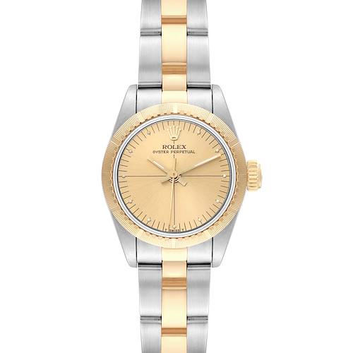 This image shows a Rolex Oyster Perpetual 67243 Women's Steel and Gold (two tone) Champagne Dial 67243 Women's Steel and Gold (two tone) Champagne Dial watch from a top-down angle, highlighting its face and two-tone bracelet.