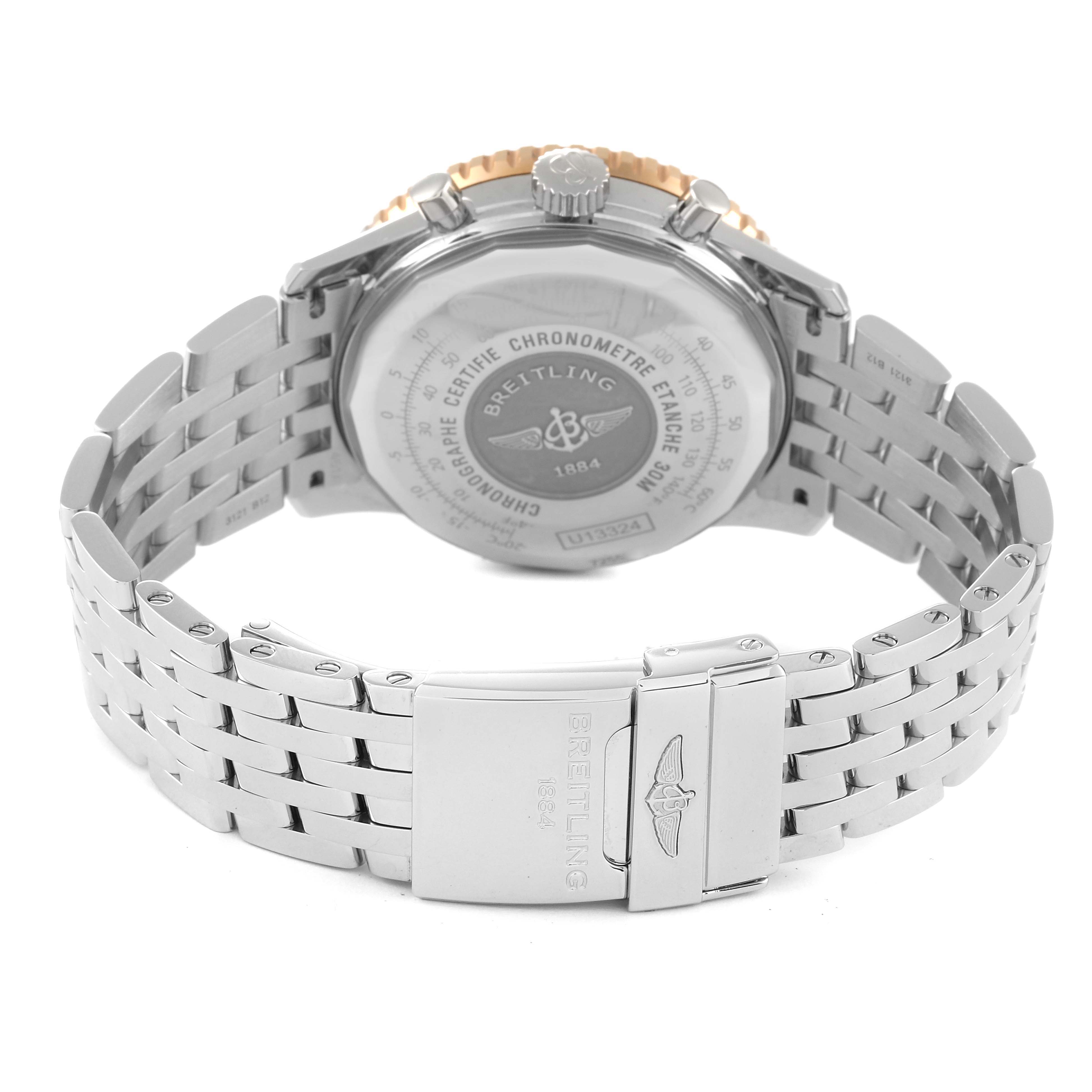 The image shows the back view of the Breitling Navitimer U13324211B1X1 Men's Steel and Gold (two tone) Black Dial U13324211B1X1 Men's Steel and Gold (two tone) Black Dial watch, focusing on the case back and the stainless steel bracelet with clasp.