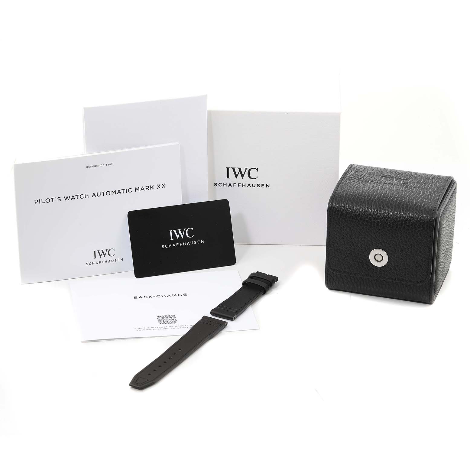 The image shows the box, manuals, an extra strap, and a care card for the IWC Pilot IW328201 Men's Stainless Steel Black Dial IW328201 Men's Stainless Steel Black Dial's Watch Automatic Mark XX.