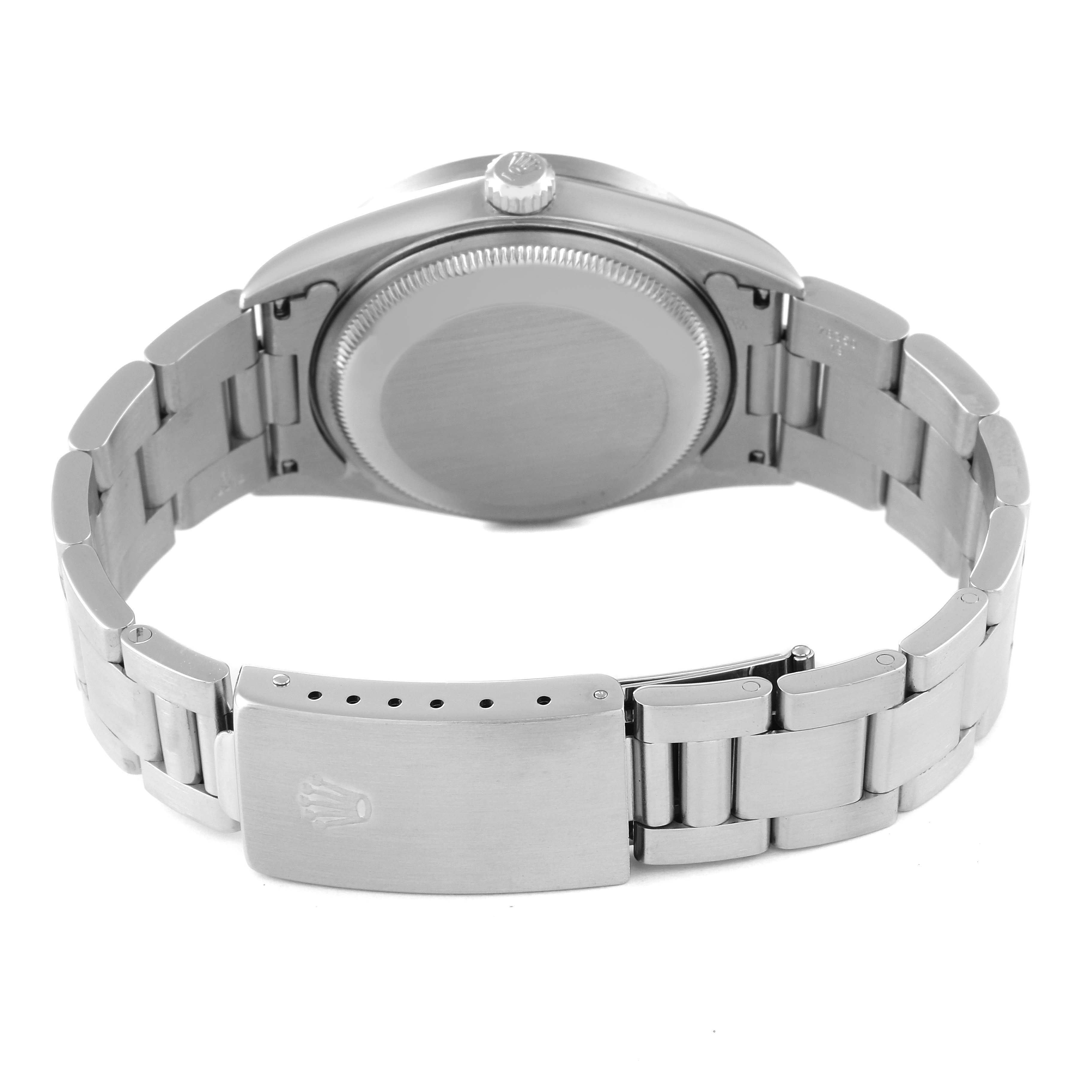 The image shows the back view of a Rolex Date 15210 Men's Stainless Steel Pink Dial 15210 Men's Stainless Steel Pink Dial model watch, highlighting the bracelet, clasp, and case back.