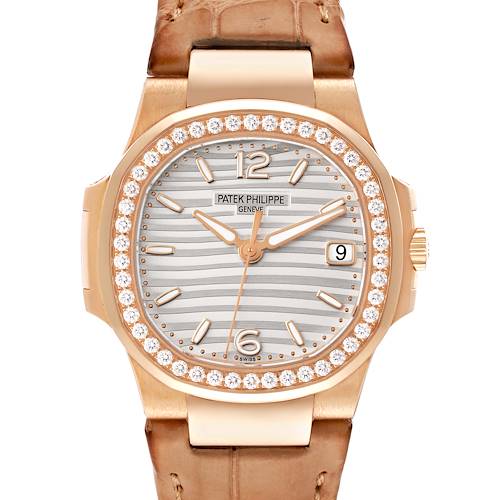 A frontal view of the Patek Philippe Nautilus 7010R Women's Rose Gold Silver Dial 7010R Women's Rose Gold Silver Dial watch, showing the dial, bezel with diamonds, and part of the strap.
