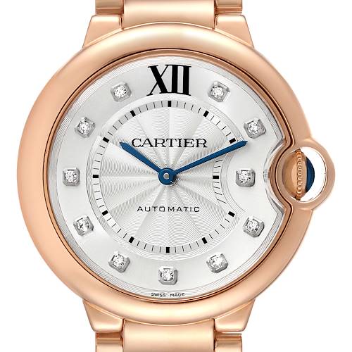 This image shows a close-up of the Cartier Ballon Bleu WE902026 Women's Rose Gold Silver Dial WE902026 Women's Rose Gold Silver Dial watch face, highlighting the dial, hour markers, hands, and crown.