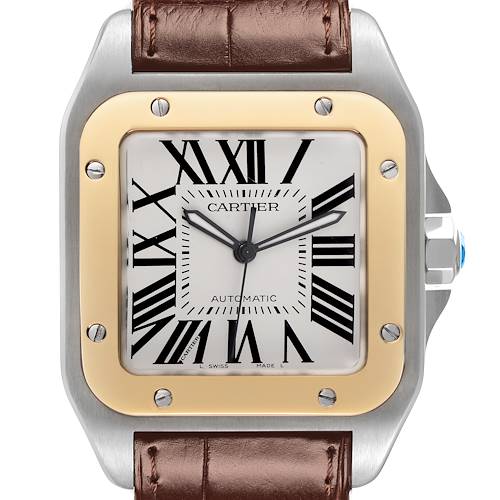 The Cartier Santos W20072X7 Men's Steel and Gold (two tone) Silver Dial W20072X7 Men's Steel and Gold (two tone) Silver Dial watch is shown from the front, highlighting its square face, Roman numerals, steel and gold bezel, and brown leather strap.