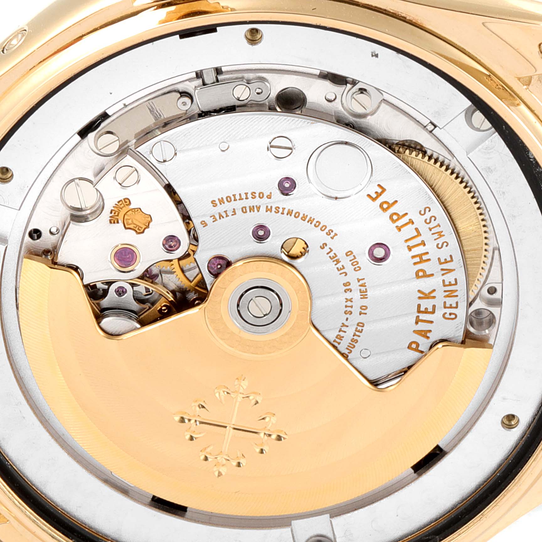 The image shows the back view of a Patek Philippe 5146J - 01D Men's Yellow Gold Grey Dial 5146J - 01D Men's Yellow Gold Grey Dial Complicated Annual Calendar Yellow Gold Mens Watch 5146, highlighting its intricate movement.