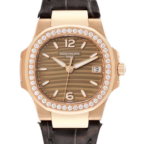 The image shows a front view of a Patek Philippe Nautilus 7010R-012 Women's Rose Gold Champagne Dial 7010R-012 Women's Rose Gold Champagne Dial watch, highlighting its bezel, dial, hands, and crown.