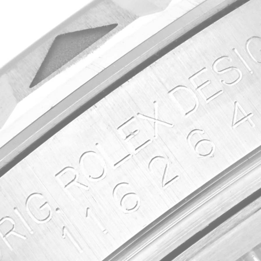 This image shows an engraving on the side of the bezel and case of a Rolex Turn-o-Graph 116264 Men's Stainless Steel White Dial 116264 Men's Stainless Steel White Dial watch.