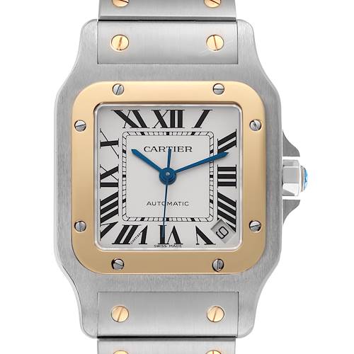 The image shows a front view of the Cartier Santos W20099C4 Men's Steel and Gold (two tone) Silver Dial W20099C4 Men's Steel and Gold (two tone) Silver Dial watch, featuring its dial, bezel, and part of the bracelet.