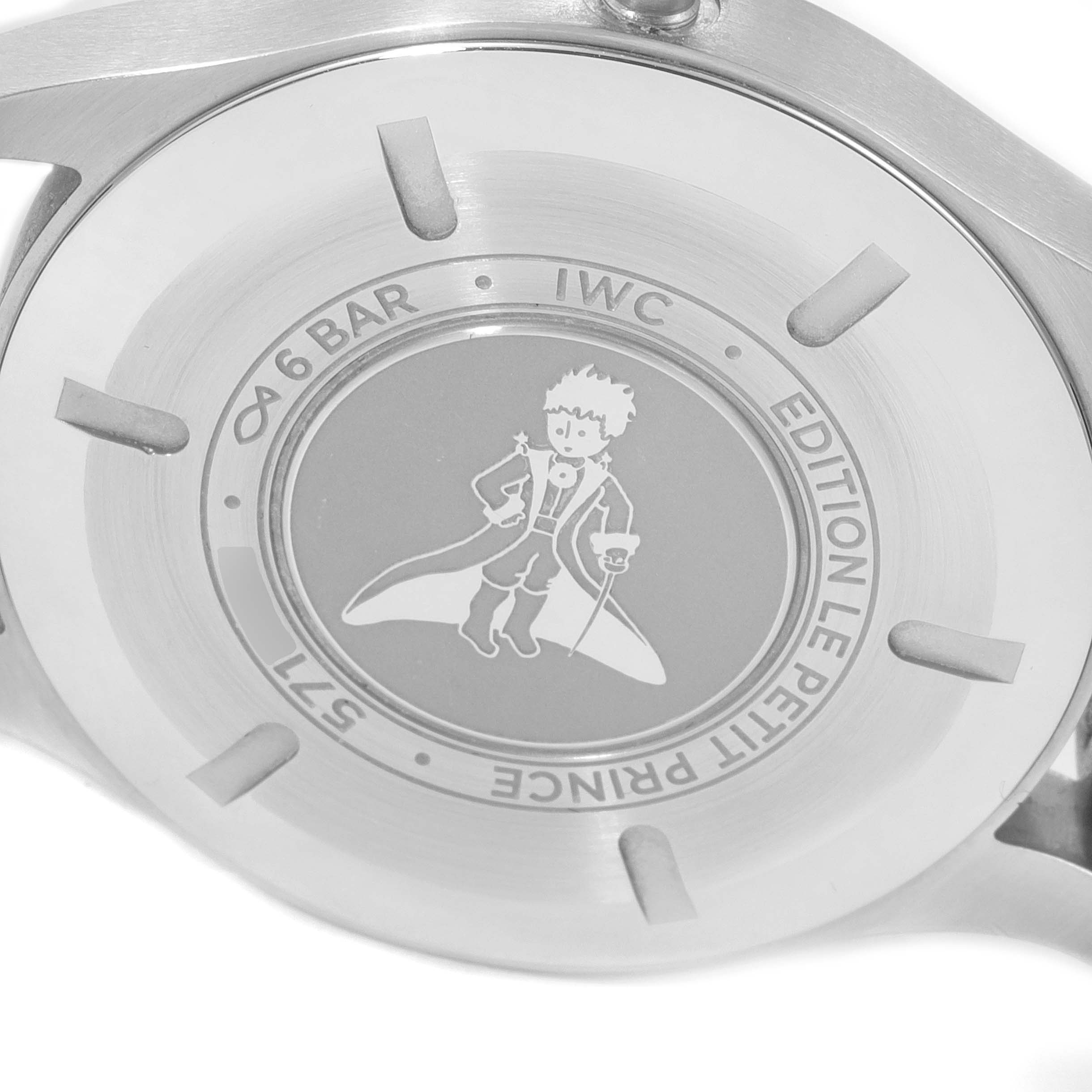 The image shows the back case of an IWC Pilot IW327010 Men's Stainless Steel Blue Dial IW327010 Men's Stainless Steel Blue Dial model watch featuring the "Edition Le Petit Prince" engraving.