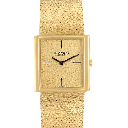 The image shows a frontal view of a Vintage Patek Philippe watch, displaying its textured dial and gold mesh bracelet.