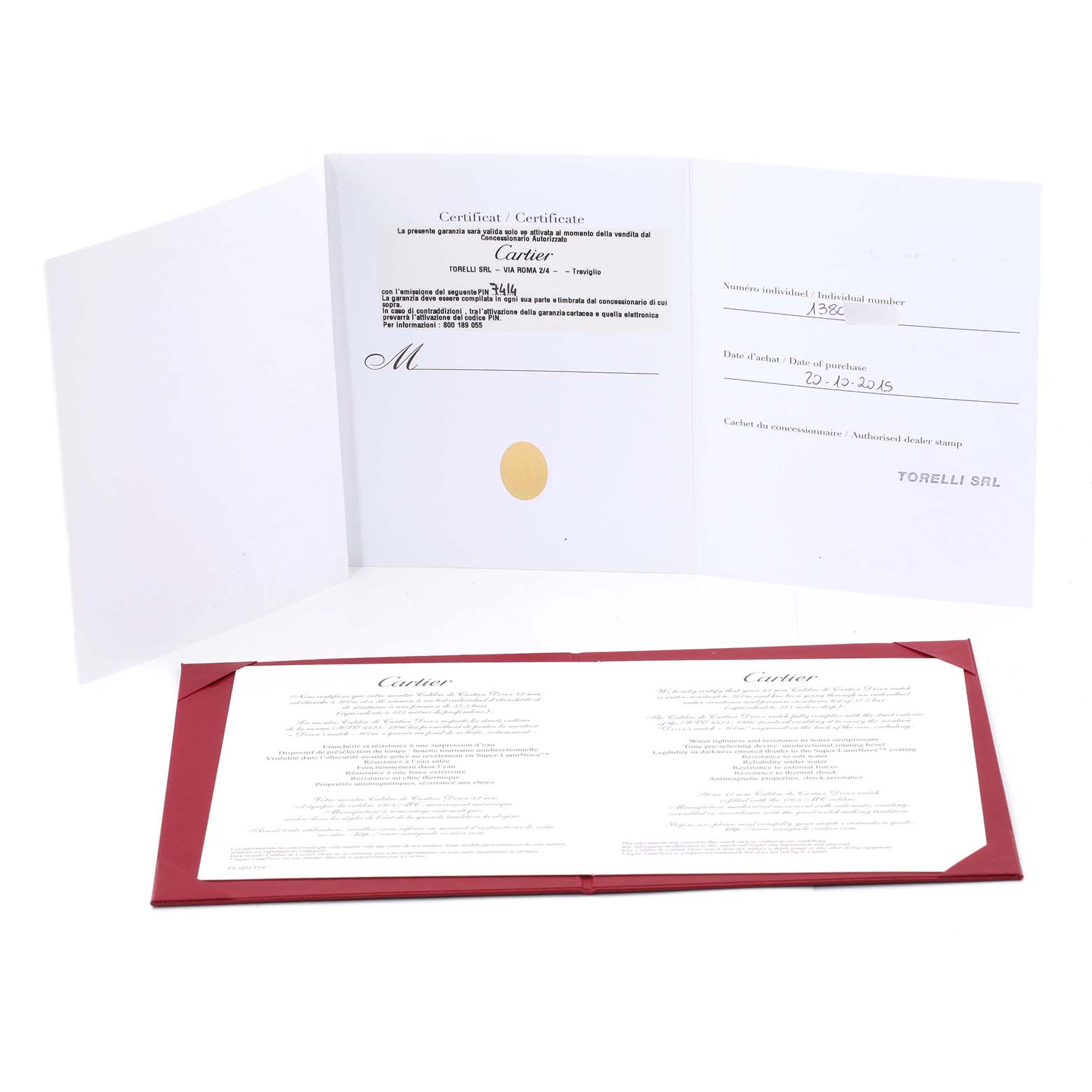 The image shows the certification and documentation for a Calibre de Cartier model by Cartier, including a booklet and stamped certificate.