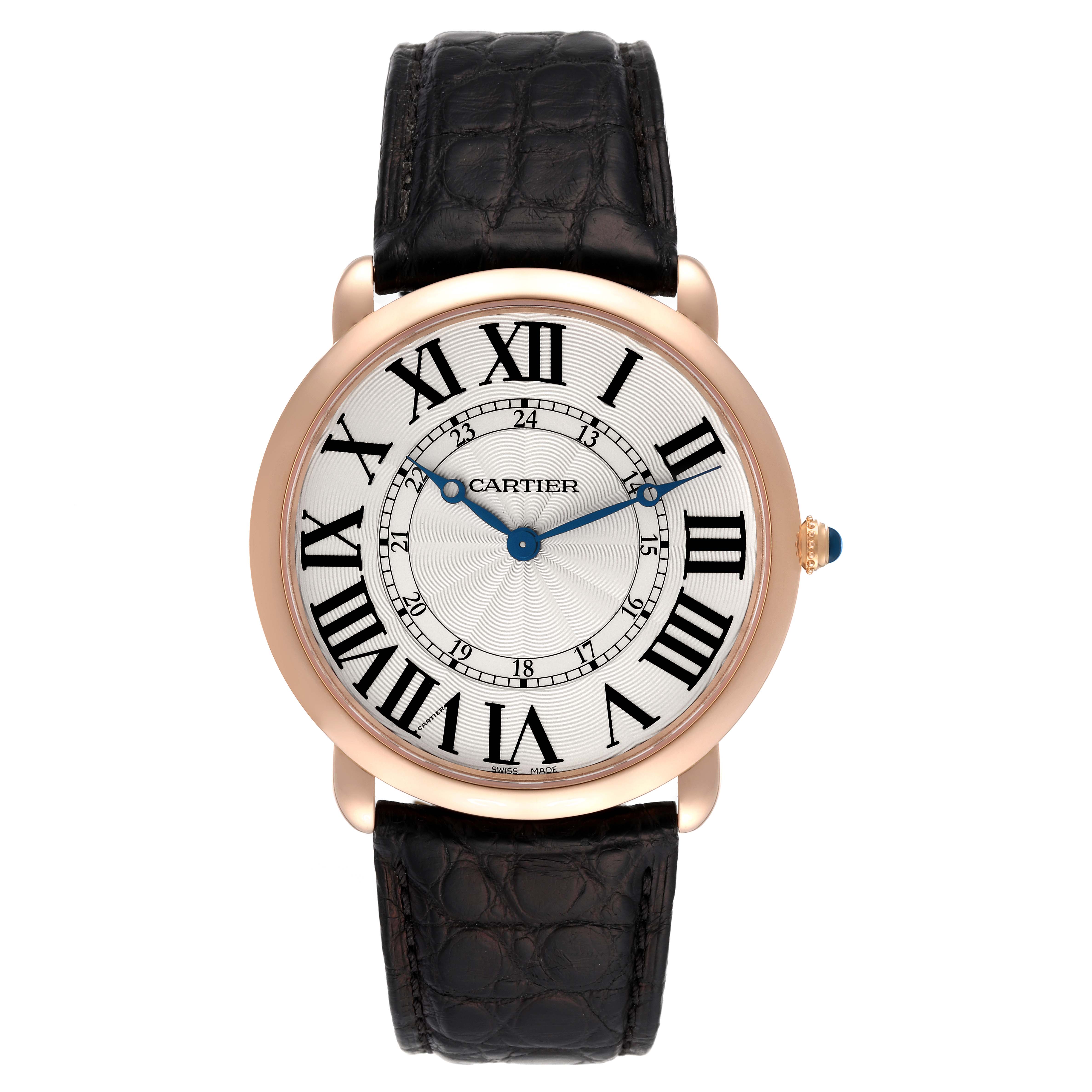 The Cartier Ronde W6801004 Men's Rose Gold Silver Dial W6801004 Men's Rose Gold Silver Dial watch is shown from a top-down angle, displaying the black leather strap, white dial, and Roman numerals.