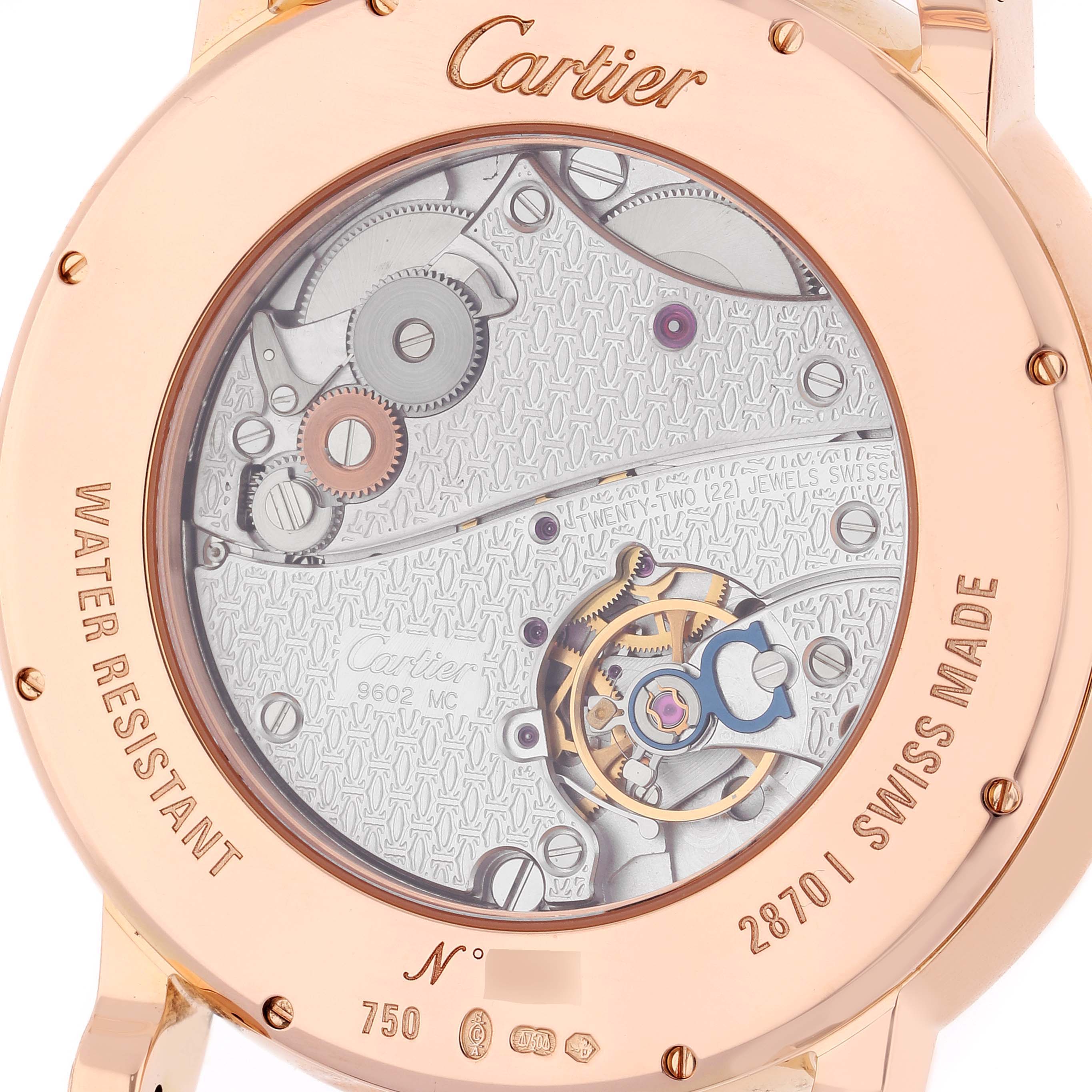 The image shows the back view of a Rotonde model by Cartier, highlighting the watch's inner mechanisms and engravings.