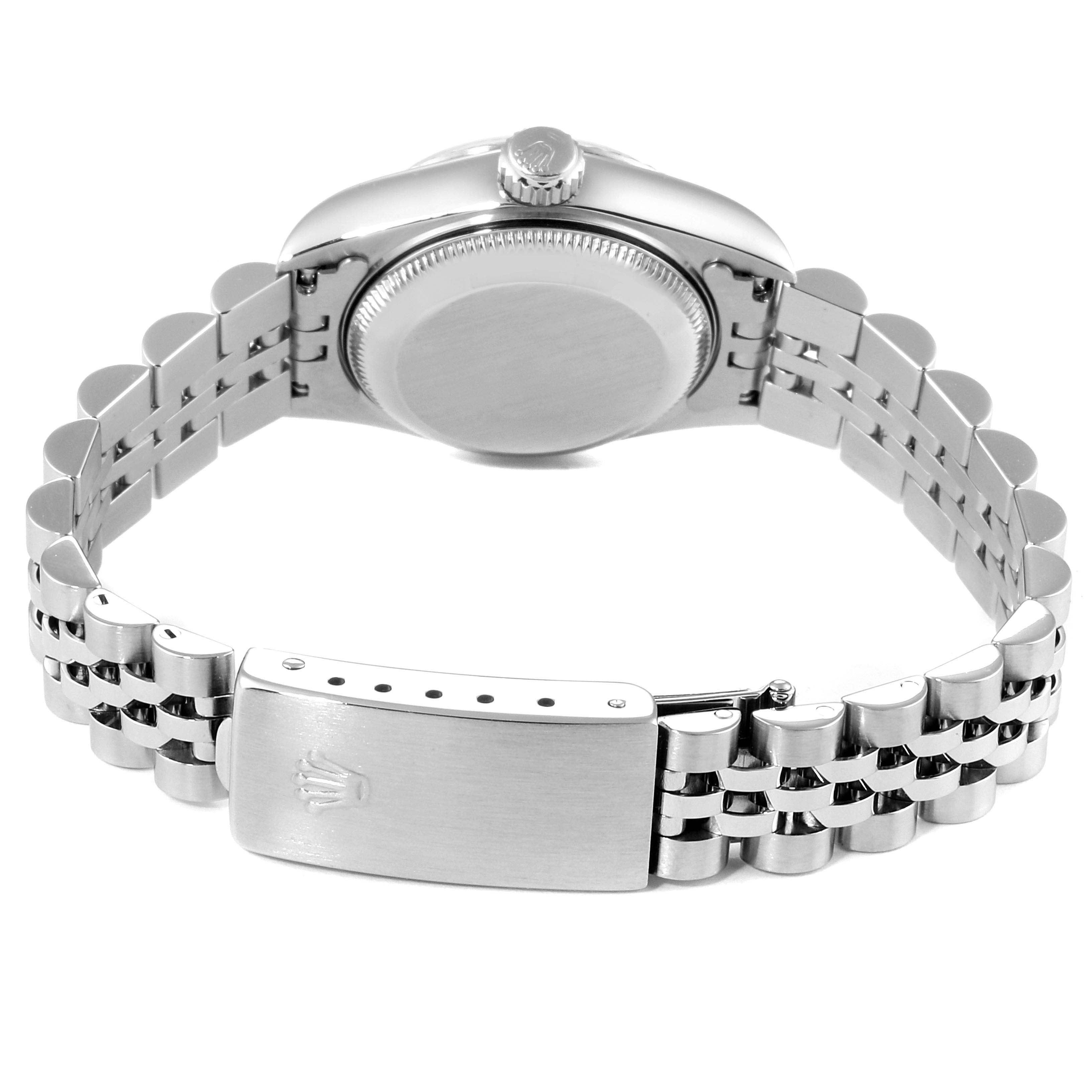 The image shows a rear view of a Rolex Datejust 69174 Women's Stainless Steel Black Dial 69174 Women's Stainless Steel Black Dial watch, highlighting the case back, crown, and bracelet with clasp.