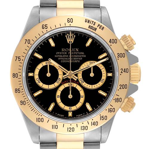 The image shows a front view of a Rolex Daytona 16523 Men's Steel and Gold (two tone) Black Dial 16523 Men's Steel and Gold (two tone) Black Dial watch, displaying the face, bezel, pushers, and part of the bracelet.