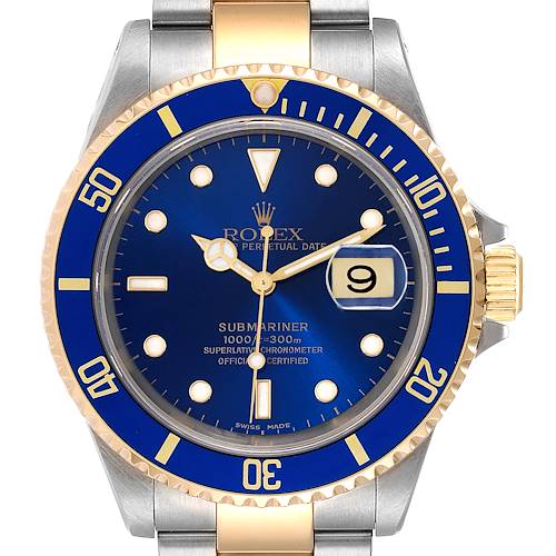 This image shows a close-up of the Rolex Submariner 16613 Men's Steel and Gold (two tone) Blue Dial 16613 Men's Steel and Gold (two tone) Blue Dial watch displaying its blue dial, date window, and two-tone bezel.