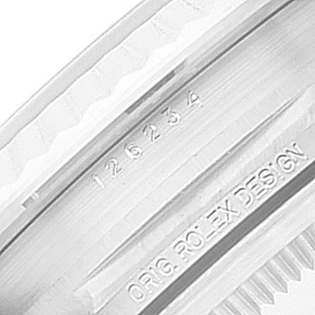 The image shows a close-up of the inner bezel and engraved details of a Rolex Datejust 126234 Men's Stainless Steel Pink Dial 126234 Men's Stainless Steel Pink Dial watch.